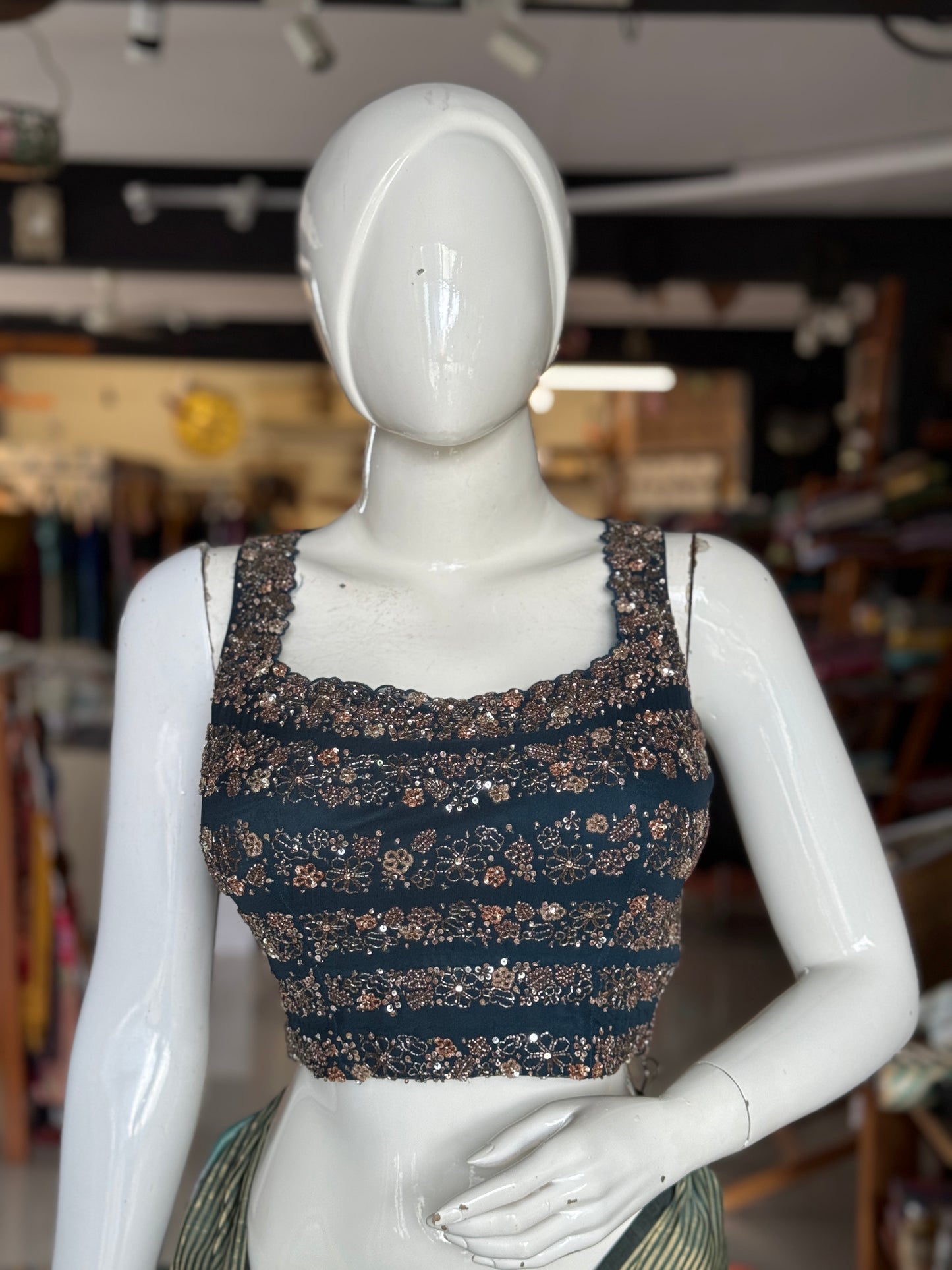 Teal hand embroidered georgette sleeveless blouse with work on front and back