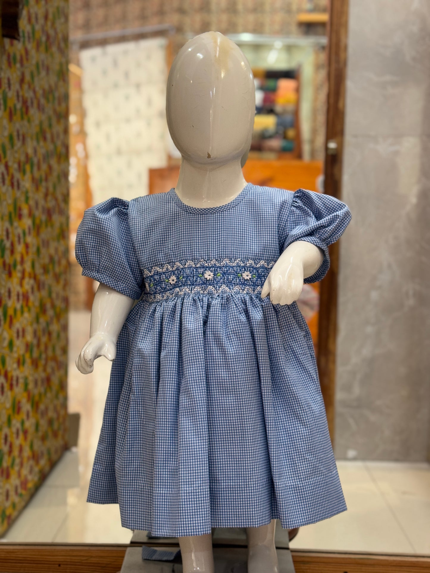 Blue checks smocking round neck cotton frock with hand embroidery