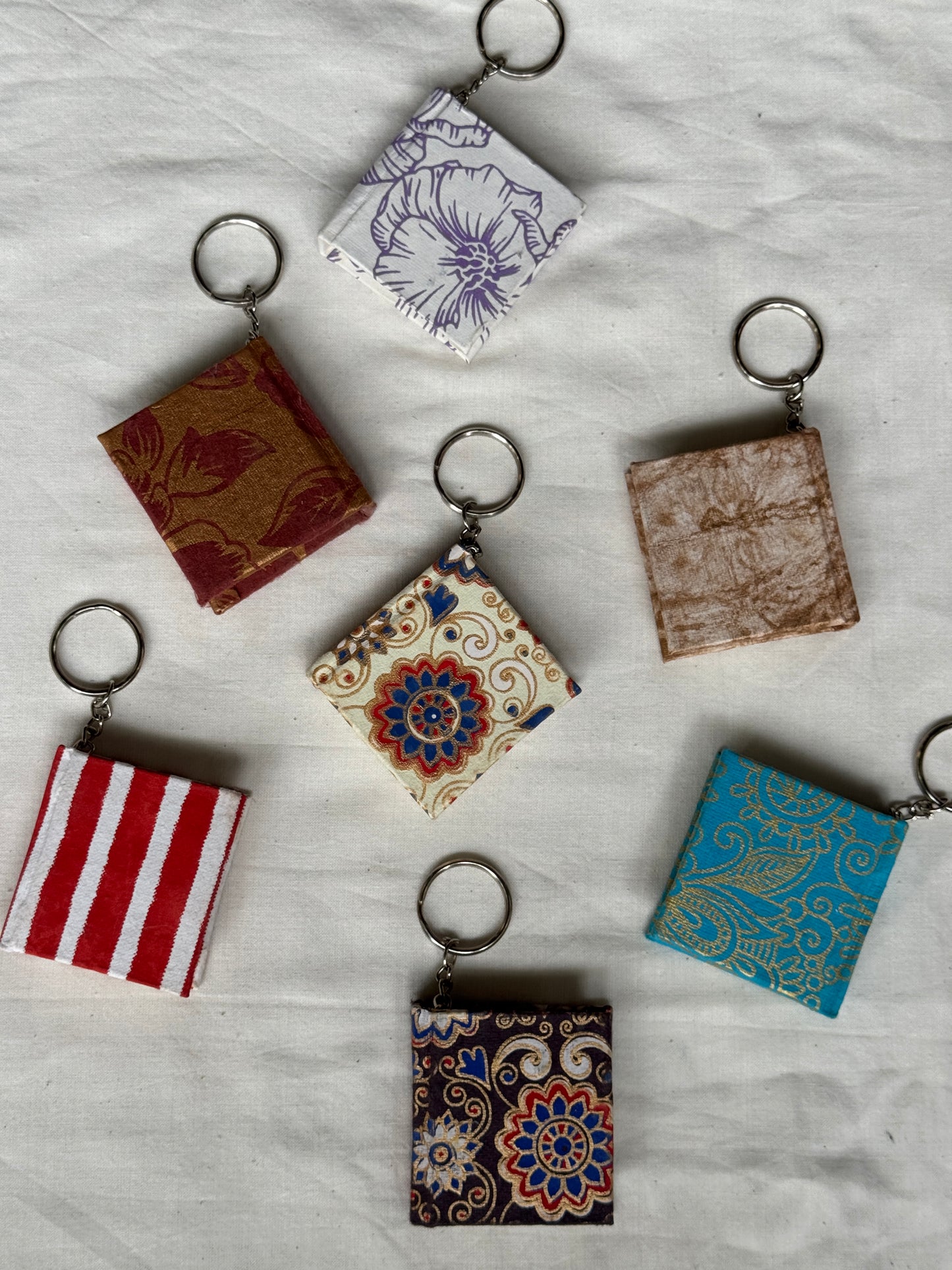 Key ring with small hand made paper notebook