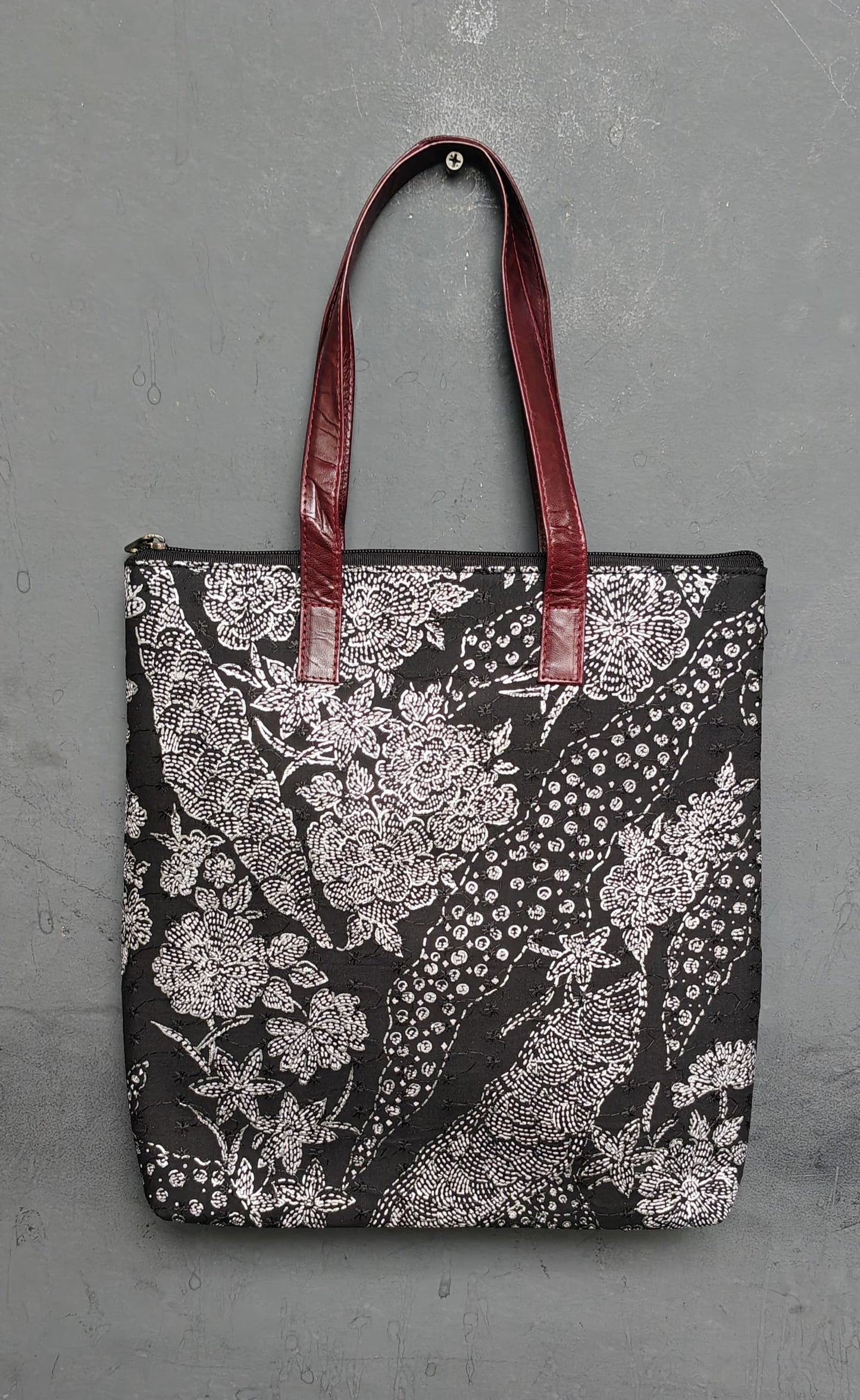Hand crafted fabric tote bag with leatherflap closure front pocket and leather handles