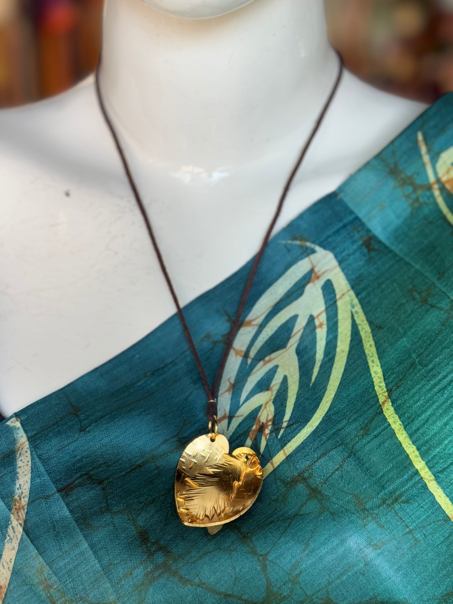 Handcrafted copper pendant with brown thread neck piece