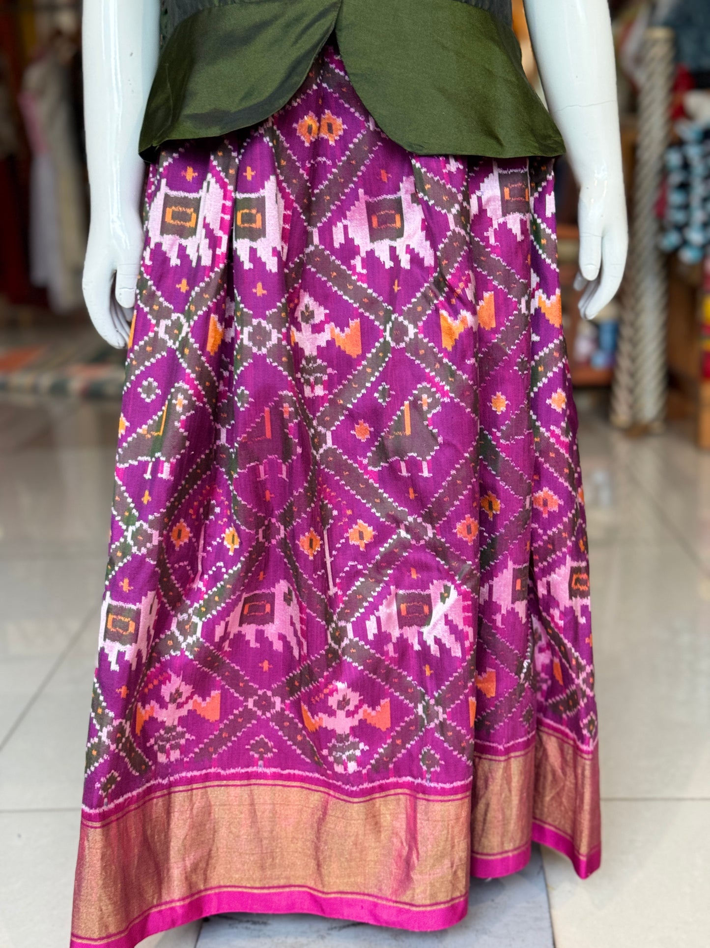 Purple handwoven ikat pure silk lehenga (pattu langa) with green puff sleeves peplum top / blouse set