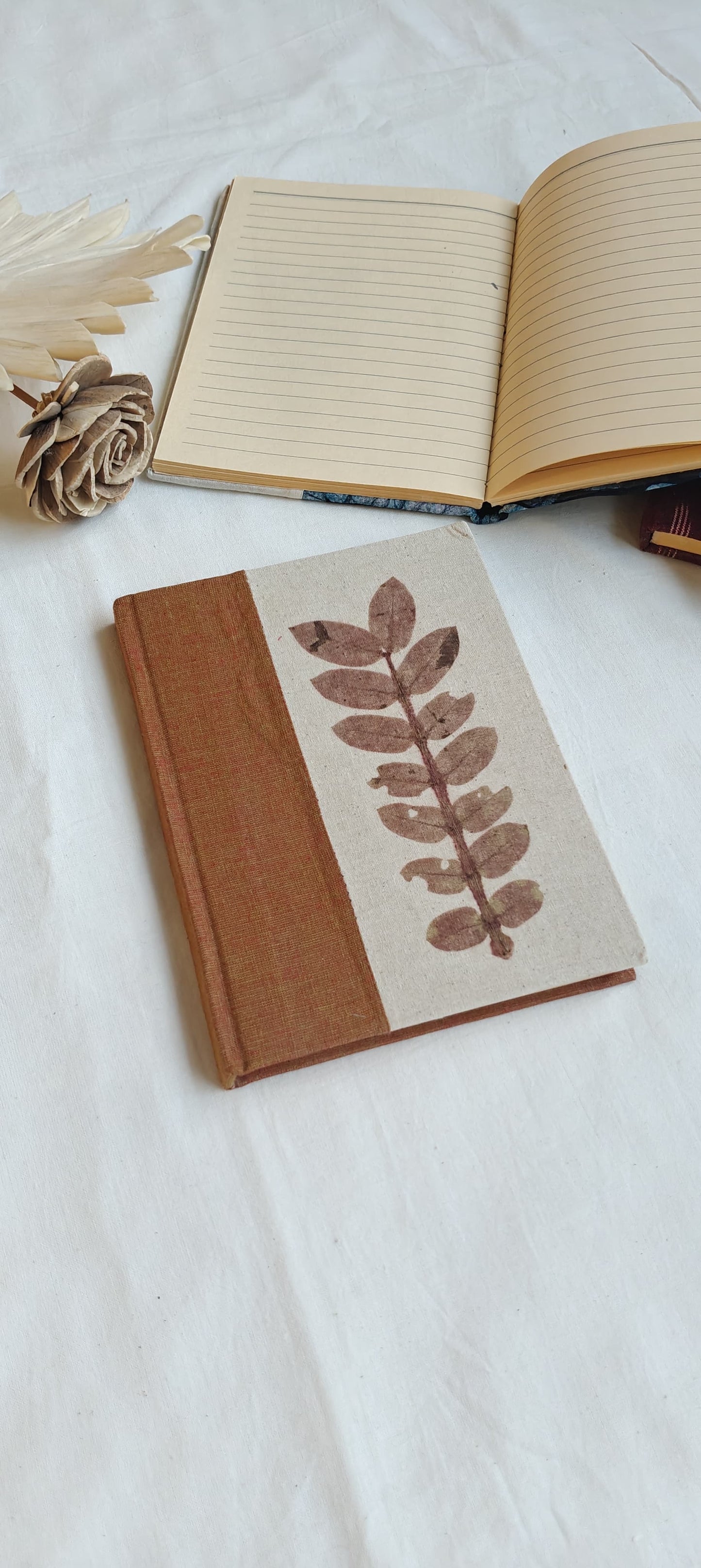 Handmade paper notebooks with hand eco printed fabric cover