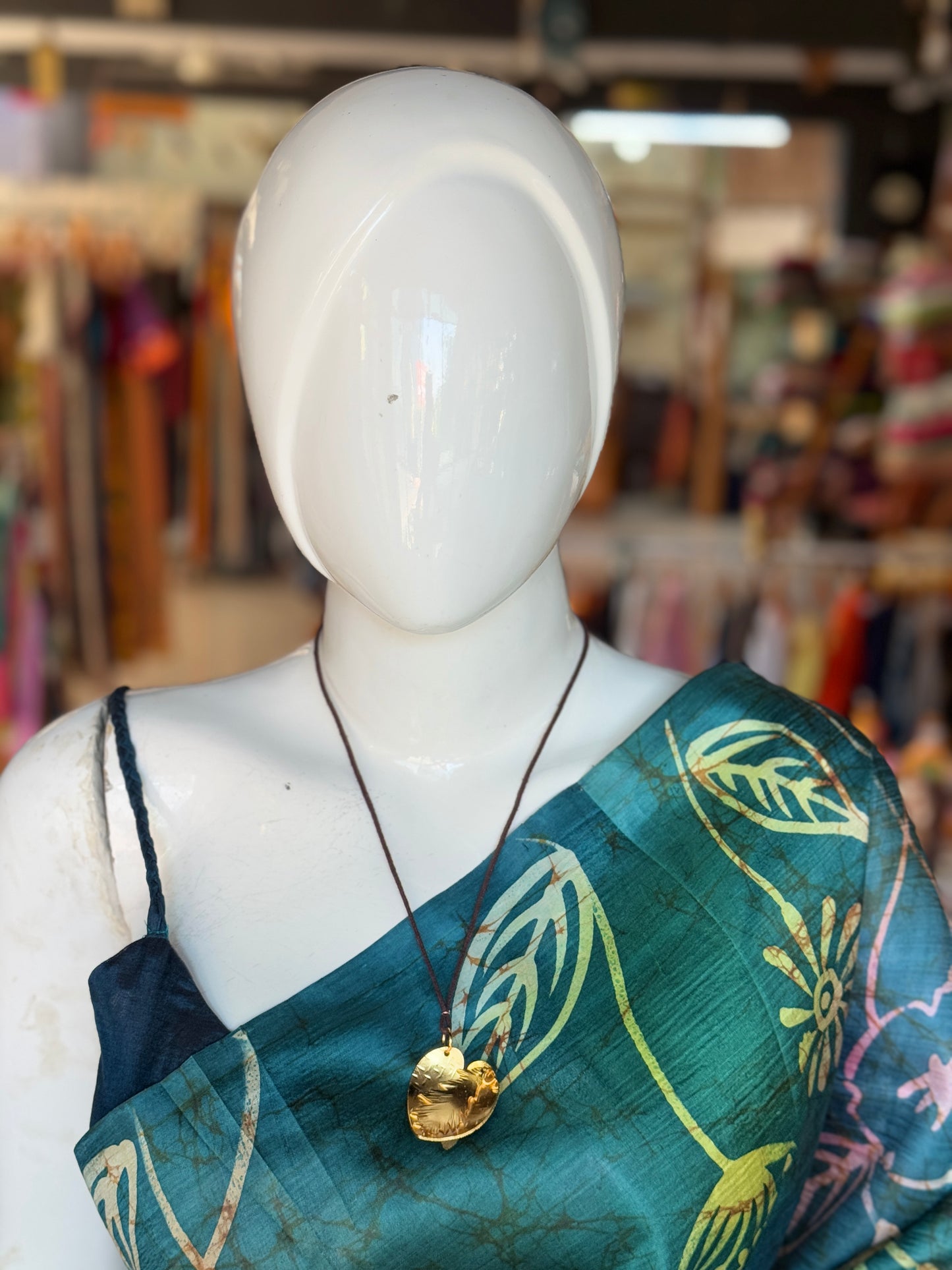 Handcrafted copper pendant with brown thread neck piece