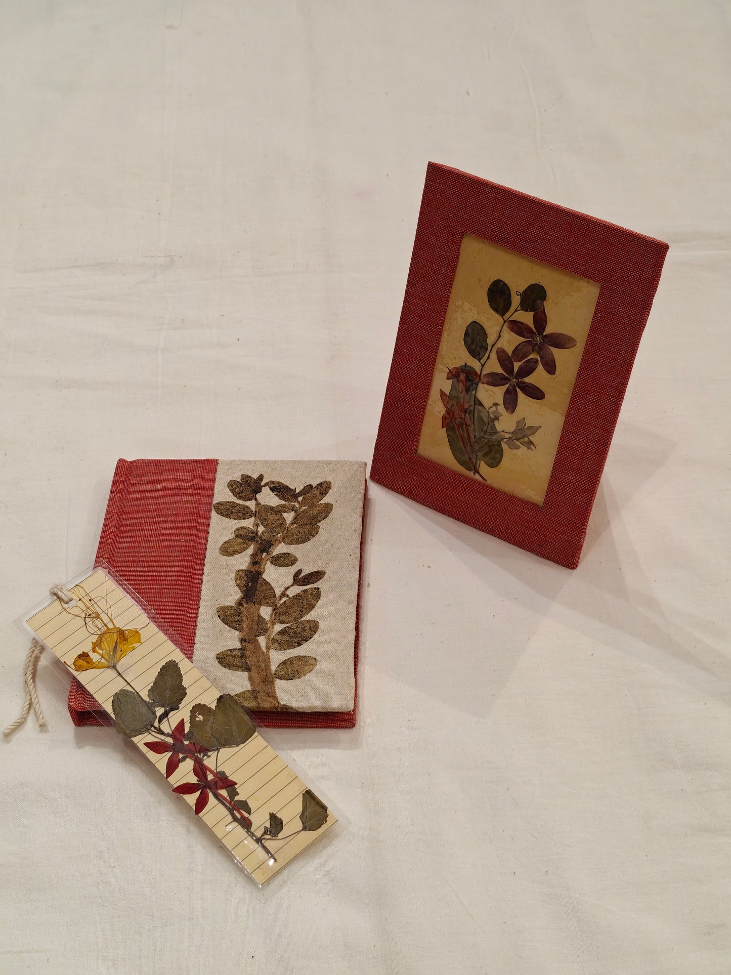 Handmade paper notebook with eco leaf printed fabric cover, hand crafted bookmark with dried flowers and a table frame pouch set