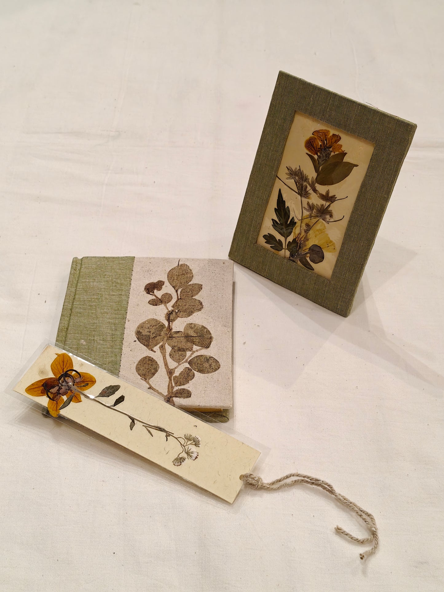 Handmade paper notebook with eco leaf printed fabric cover, hand crafted bookmark with dried flowers and a table frame pouch set