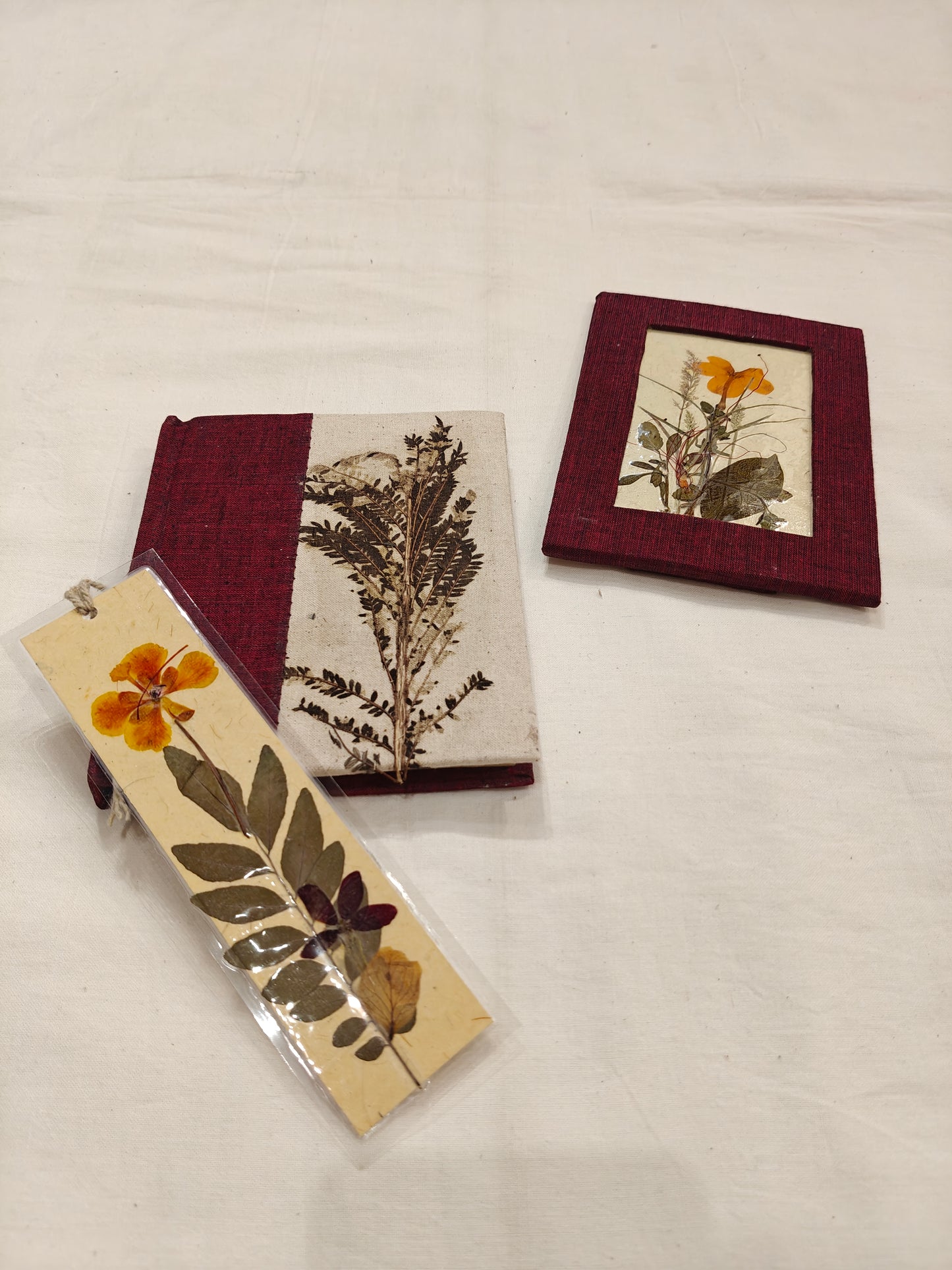 Handmade paper notebook with eco leaf printed fabric cover, hand crafted bookmark with dried flowers and a table frame pouch set