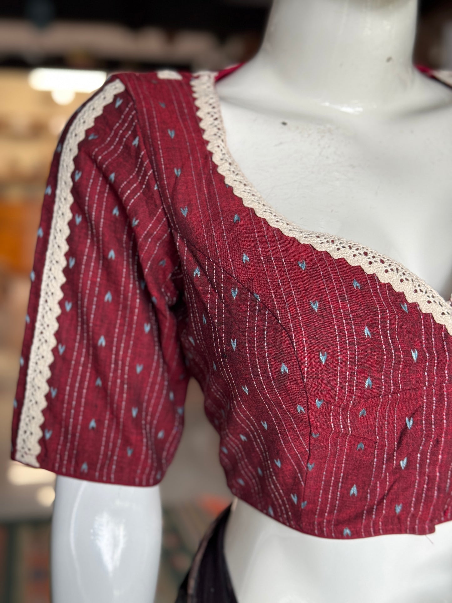 Maroon cotton blouse with multiple lace lines on back, sleeves and front