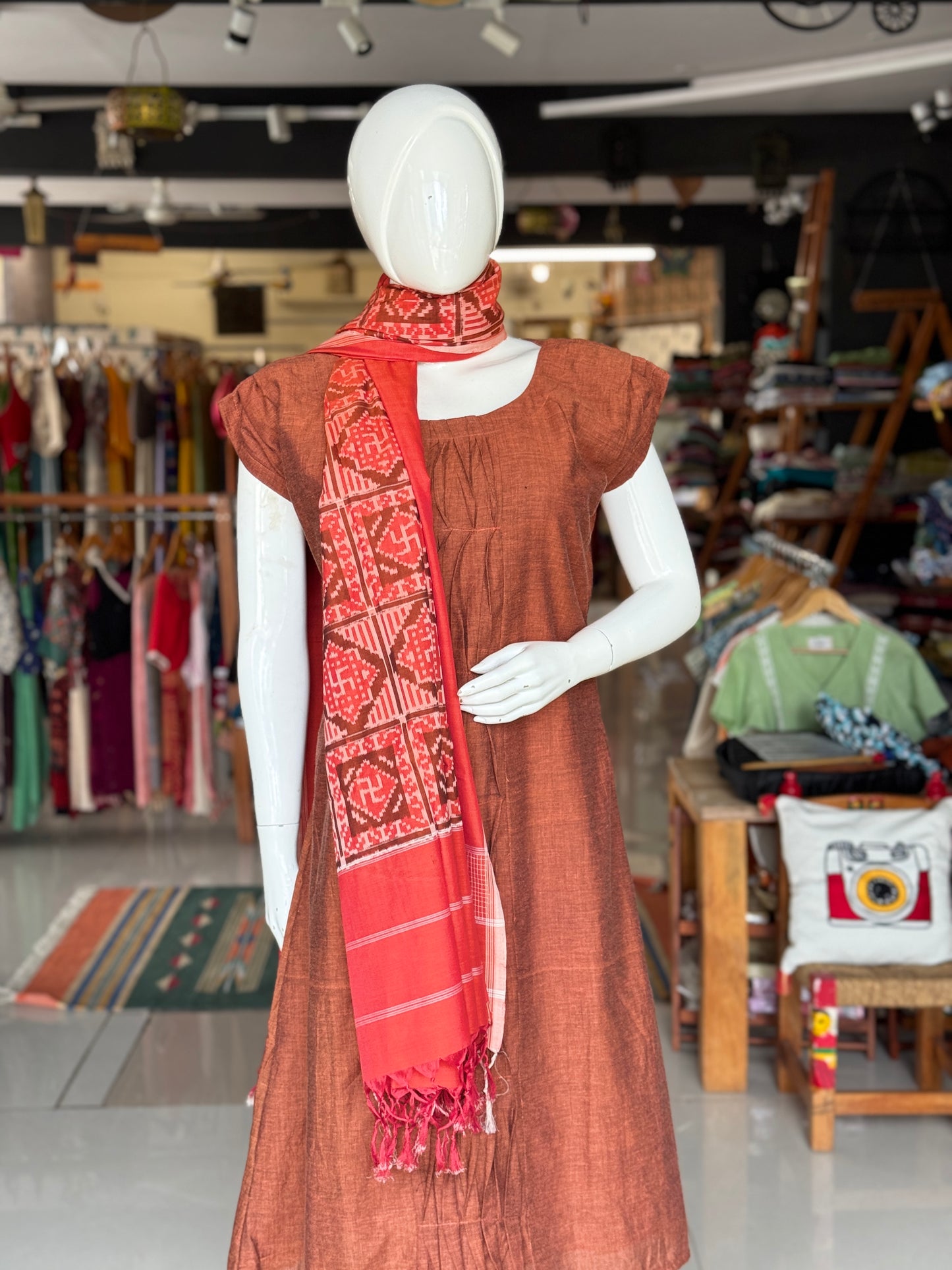 Rust tone cotton handloom soft unisex ikat stole with Swastik motifs
