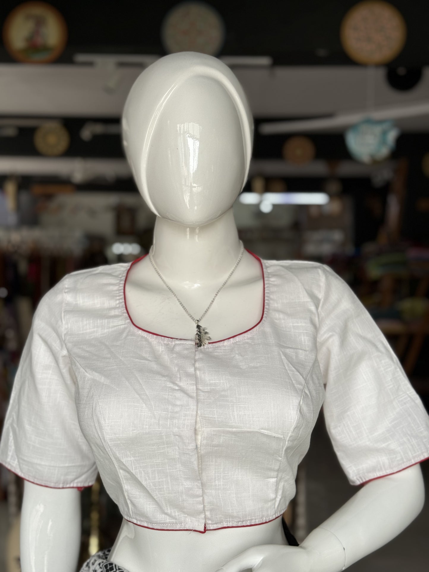 White cotton blouse with colorful bird and flowers embroidery at the back