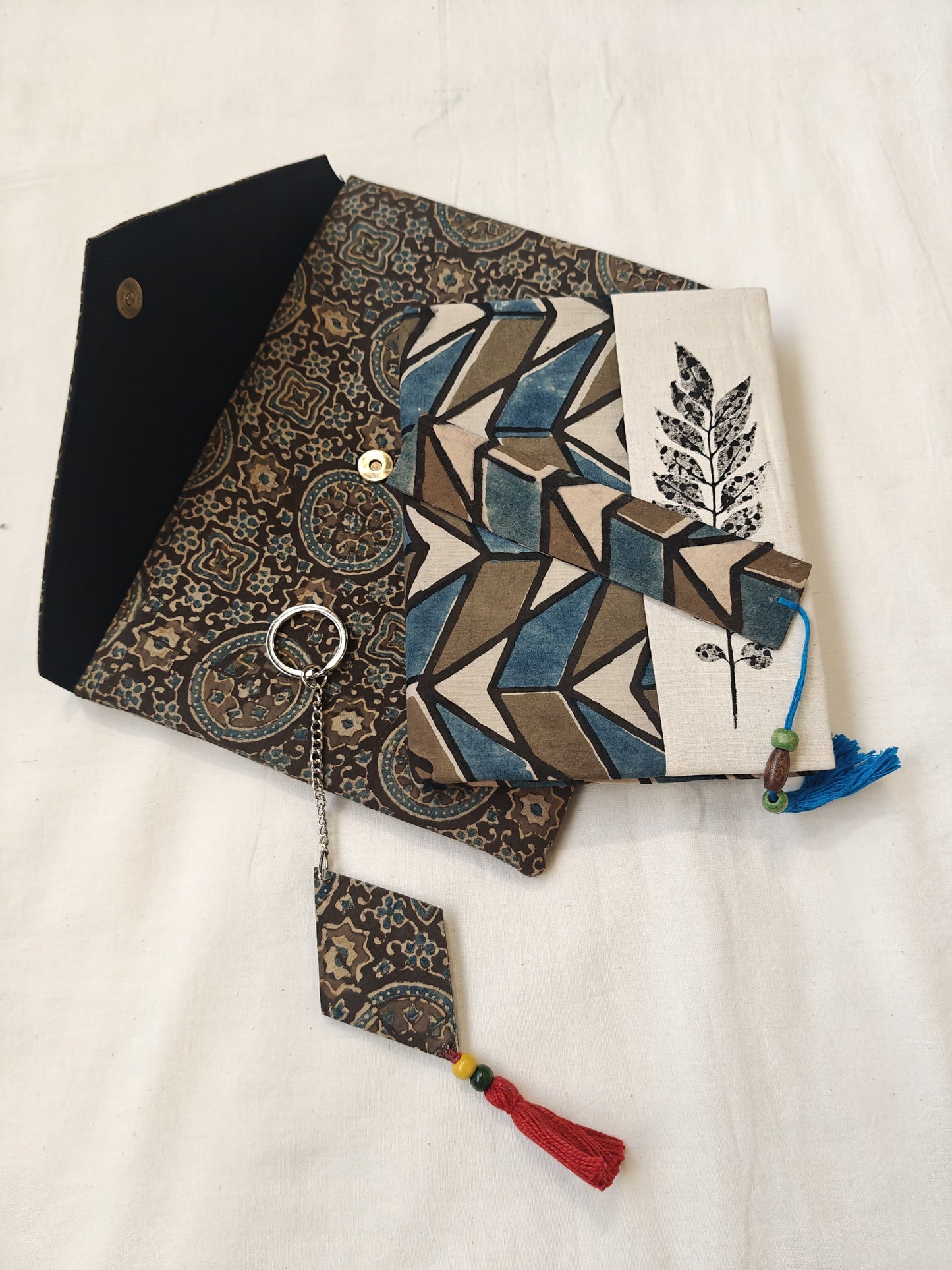 Handmade paper notebook with eco leaf printed fabric cover, hand crafted bookmark, key ring / charm and a container pouch set