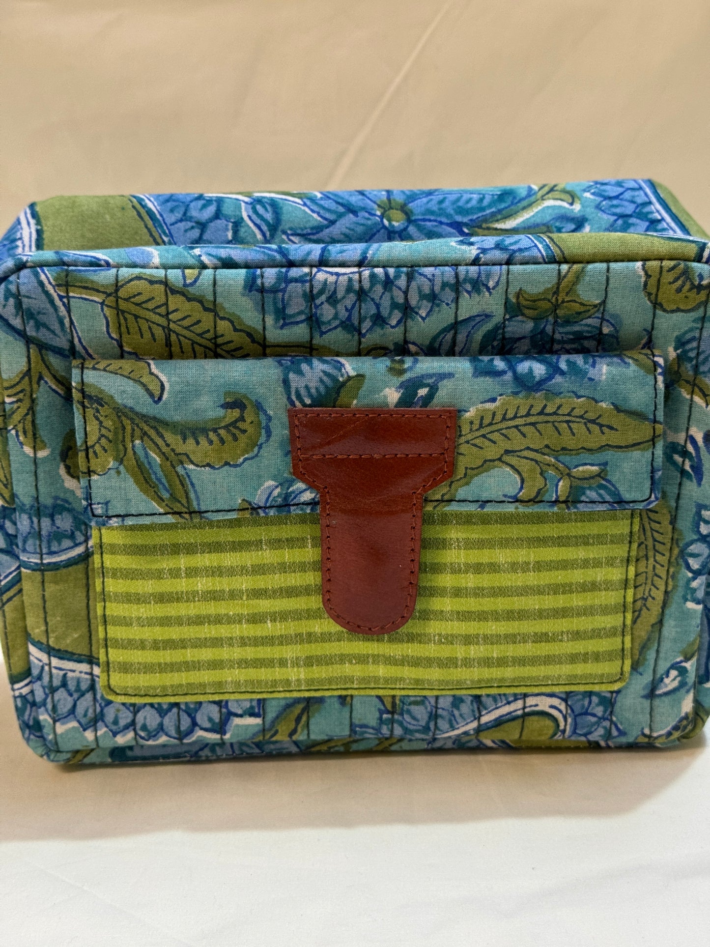 Handcrafted toiletries / travel pouch with leak proof plastic lining plus colorful front pocket with leather patch