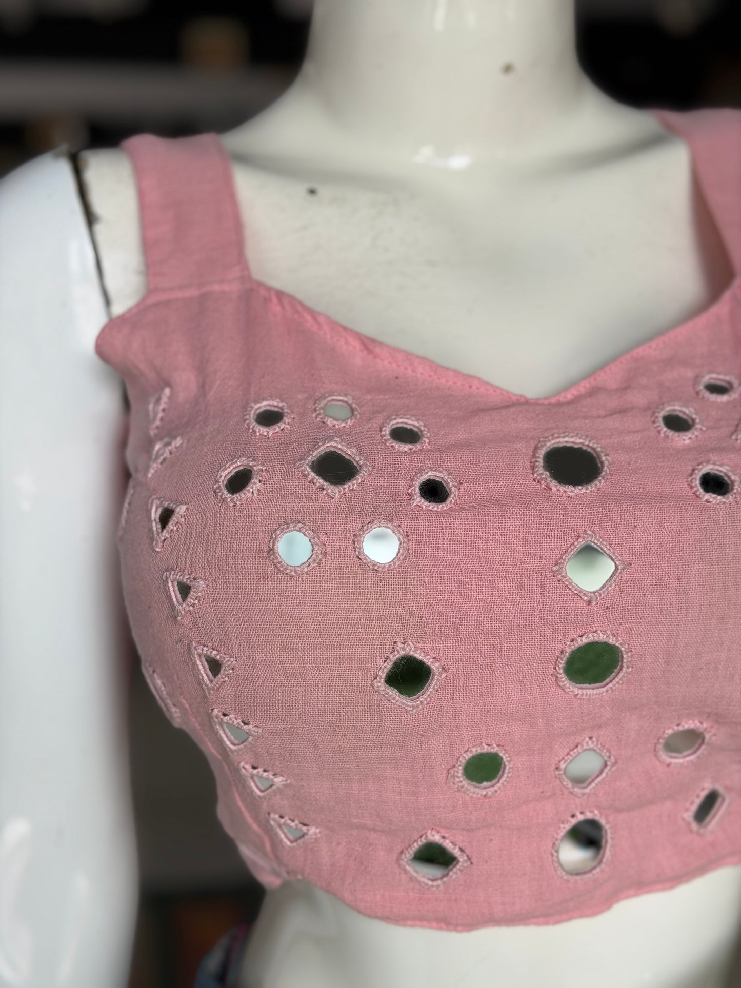 Light pink kala cotton sleeveless blouse with all over colorful mirror work on front and back