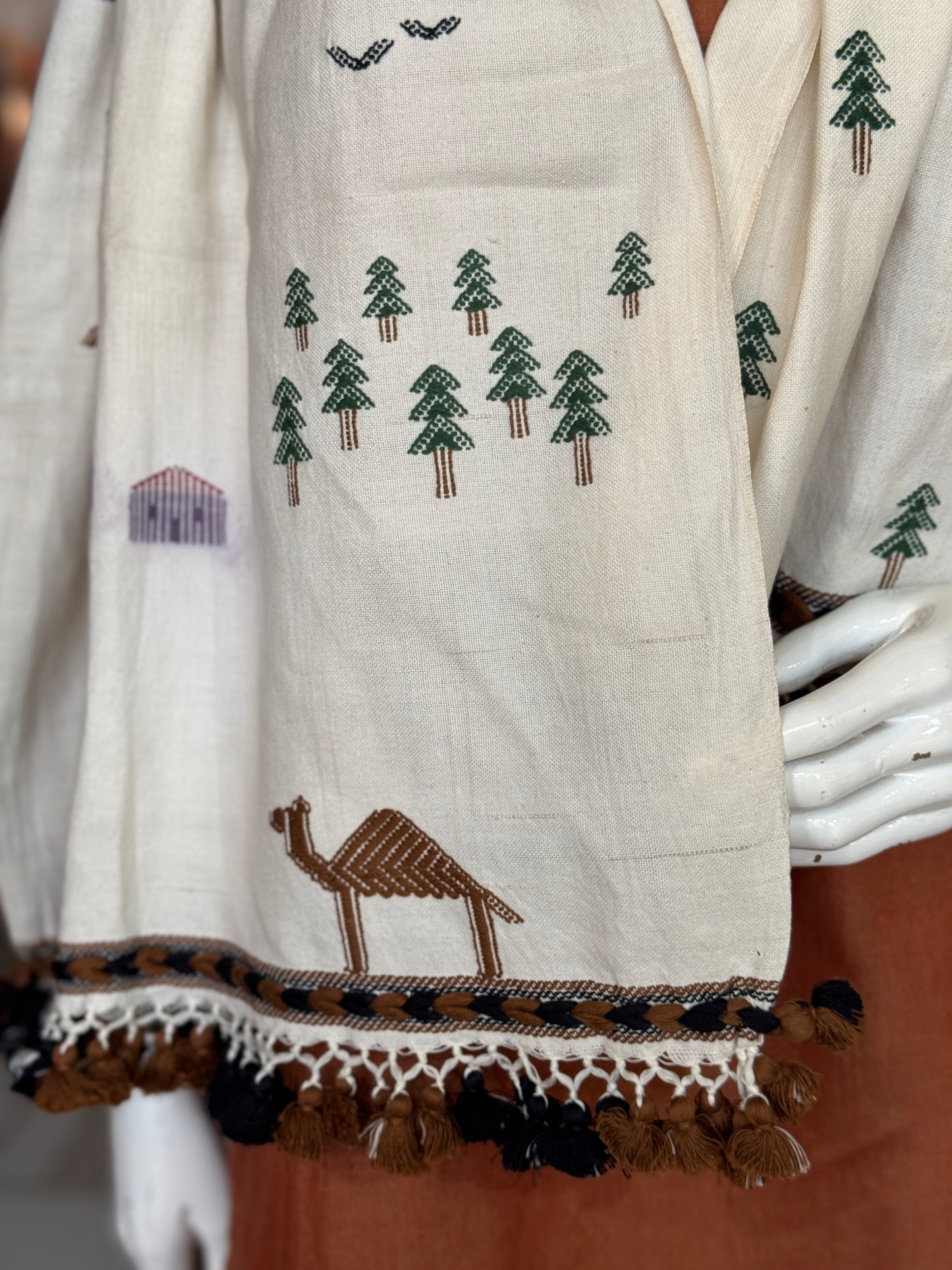 Off white Bhujodi extra weft camel and hut motifs cotton handloom stole