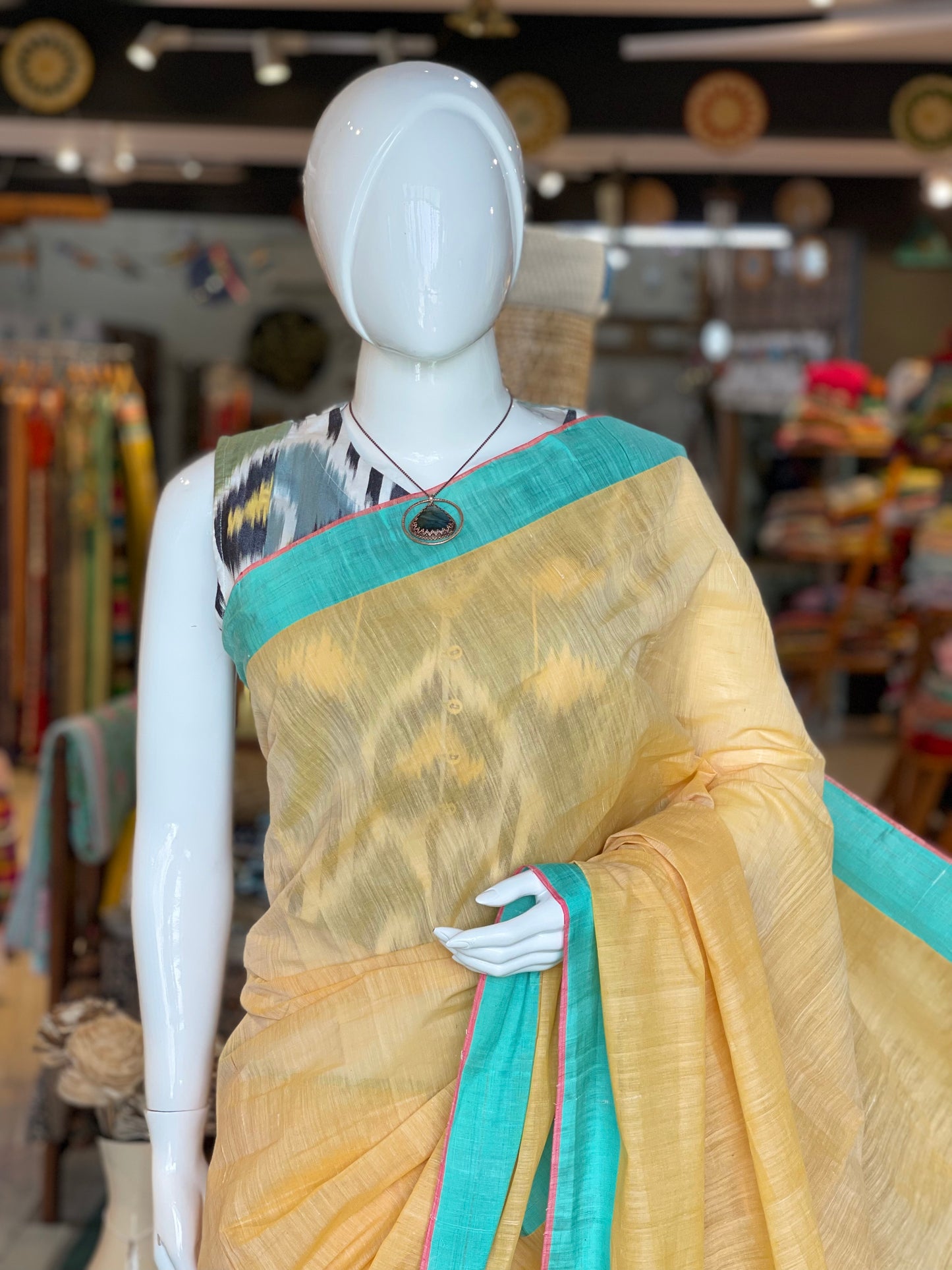 Sandal shade hand spun hand woven cotton saree with sea green and pink borders