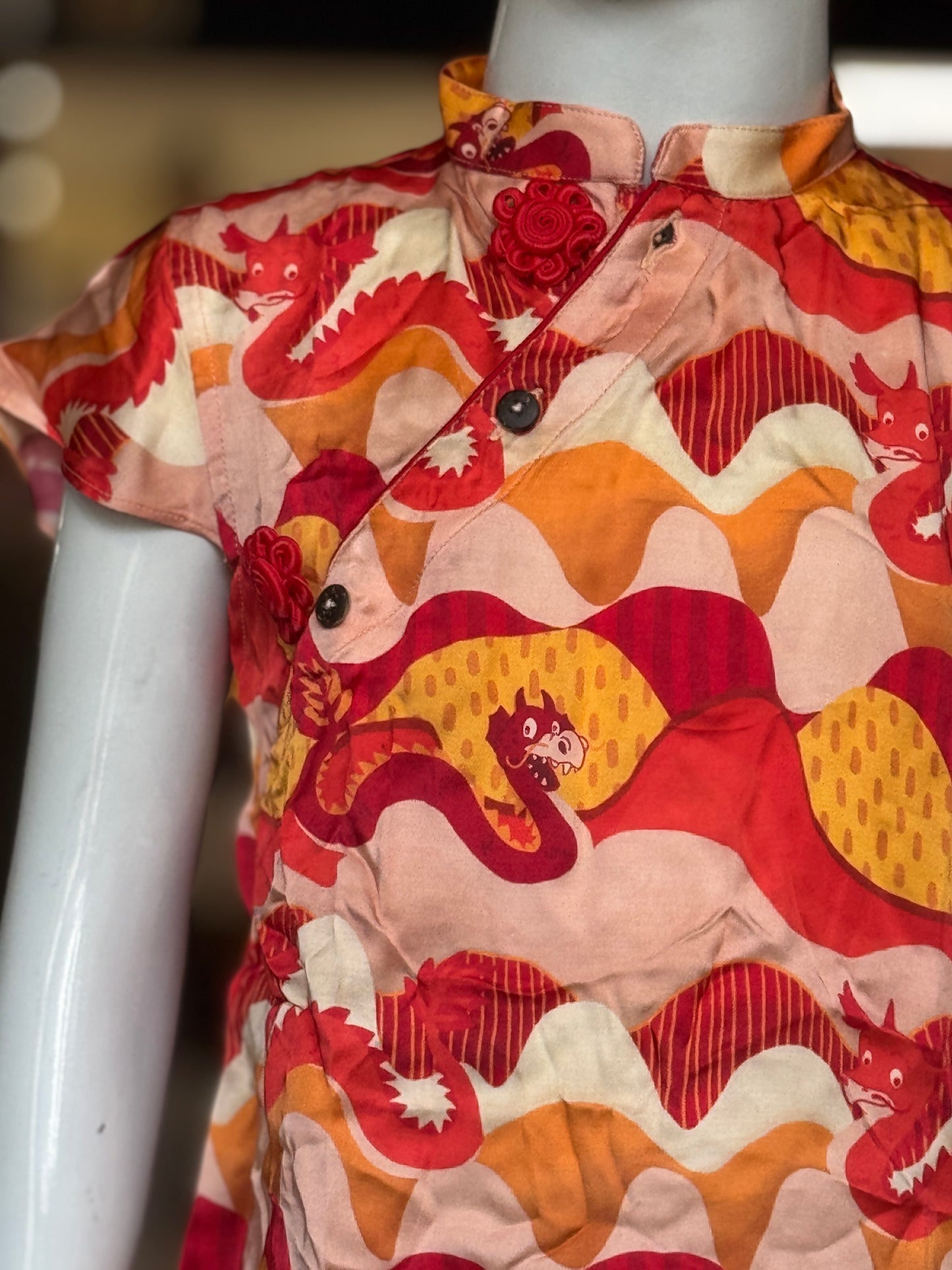 Red n orange dragon prints cross button style dress for girls