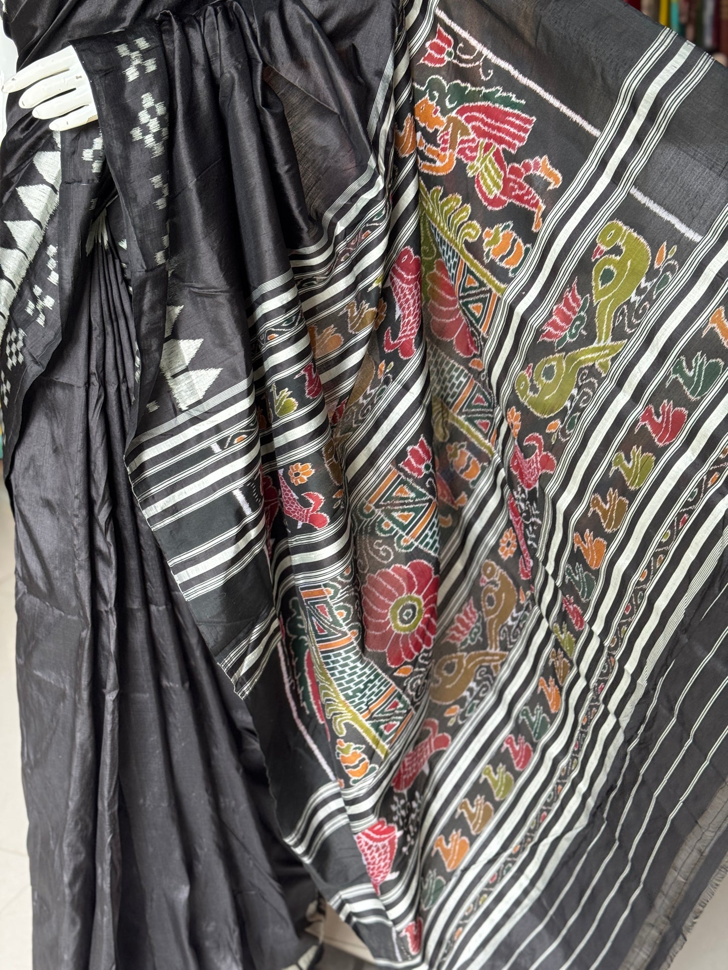 Ikat splendor - black and silver pure silk handloom saree with colorful Ikat pallu and temple border