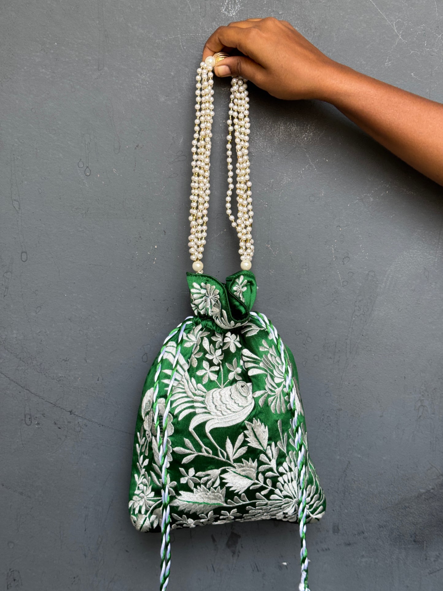 Parsi work party wear potlis with machine embroidery on art silk and pearl chain handle