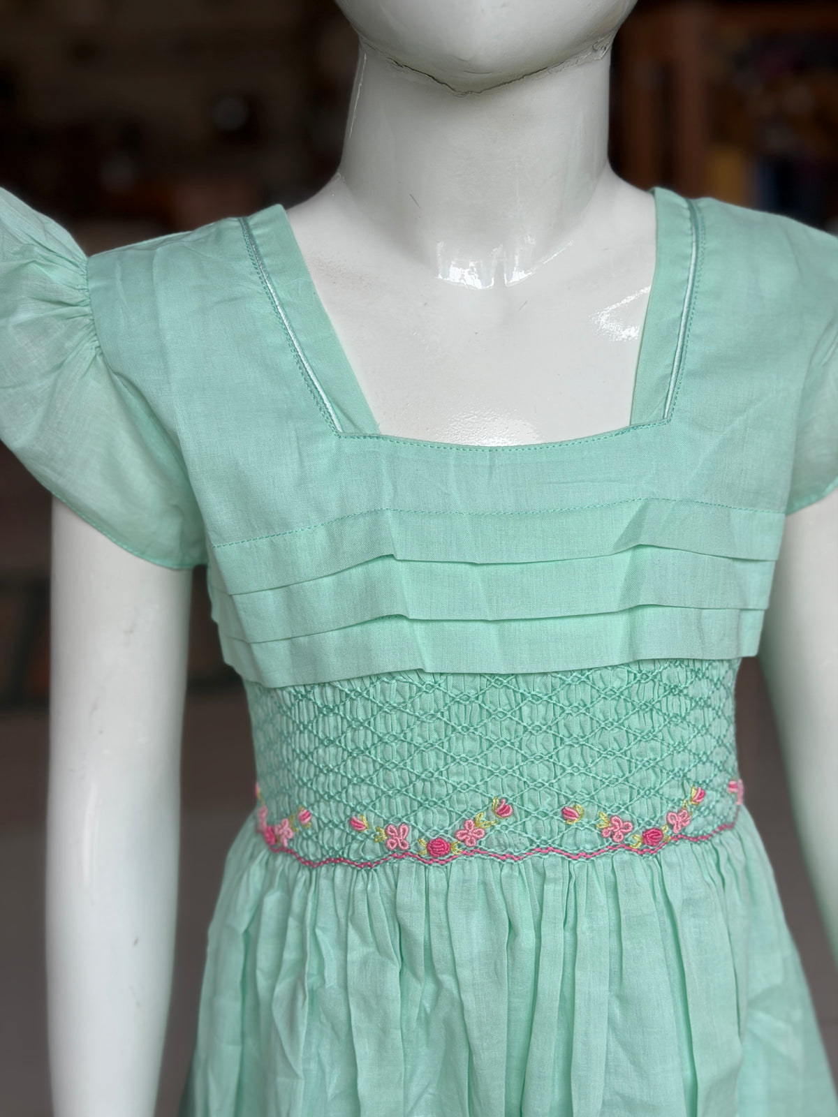 Mint green hand embroidered smocking cotton frock for girls with horizontal pintucks
