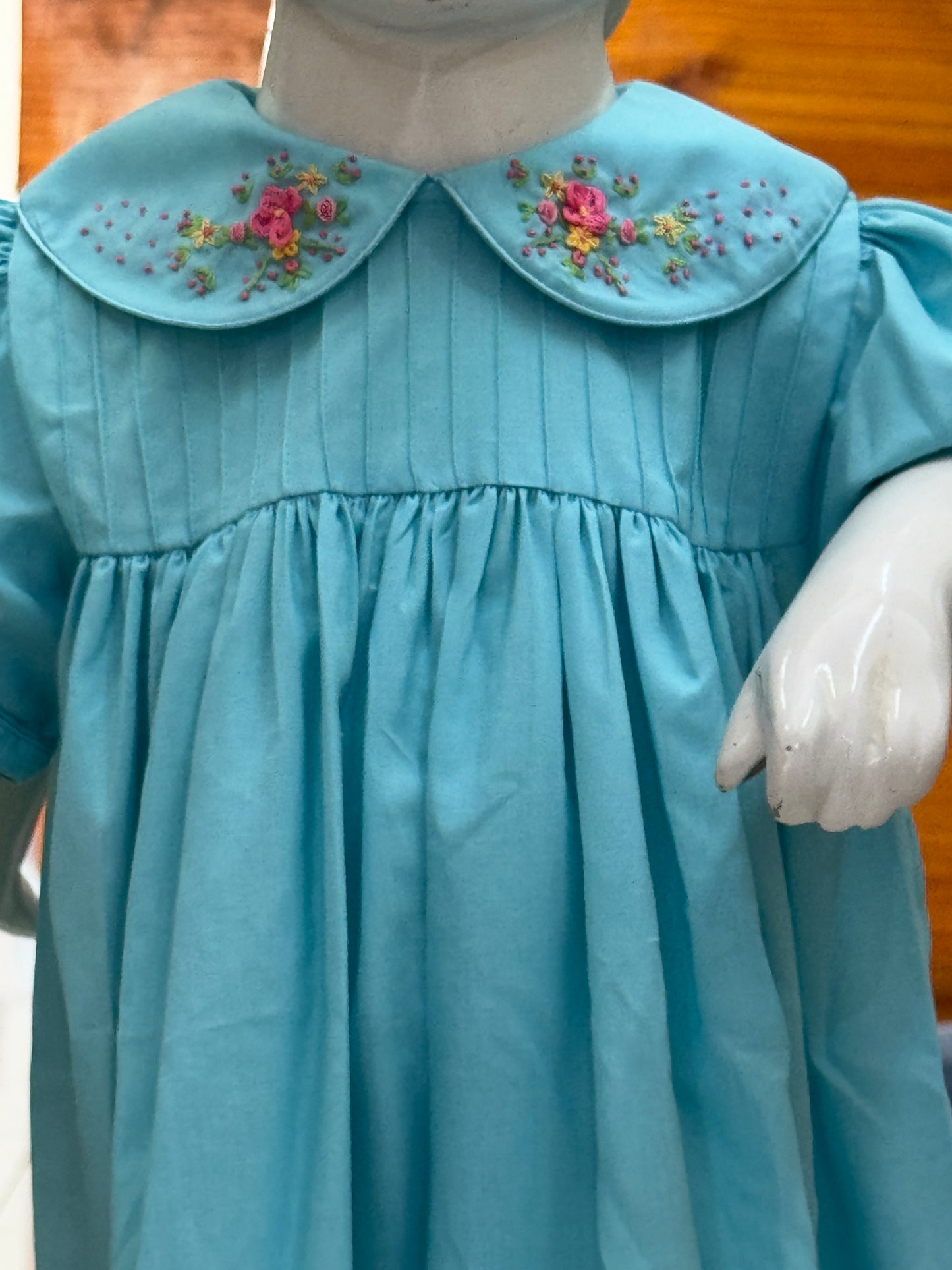 Blue cotton baby frock with flowers hand embroidery, pintucks and trims