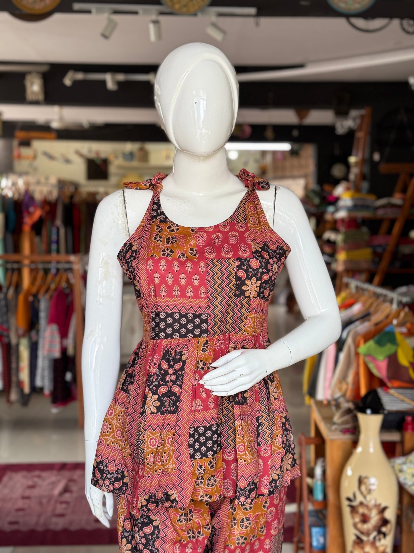 Patch work look hand block printed cotton coord set with noodles strap tie up top and pants