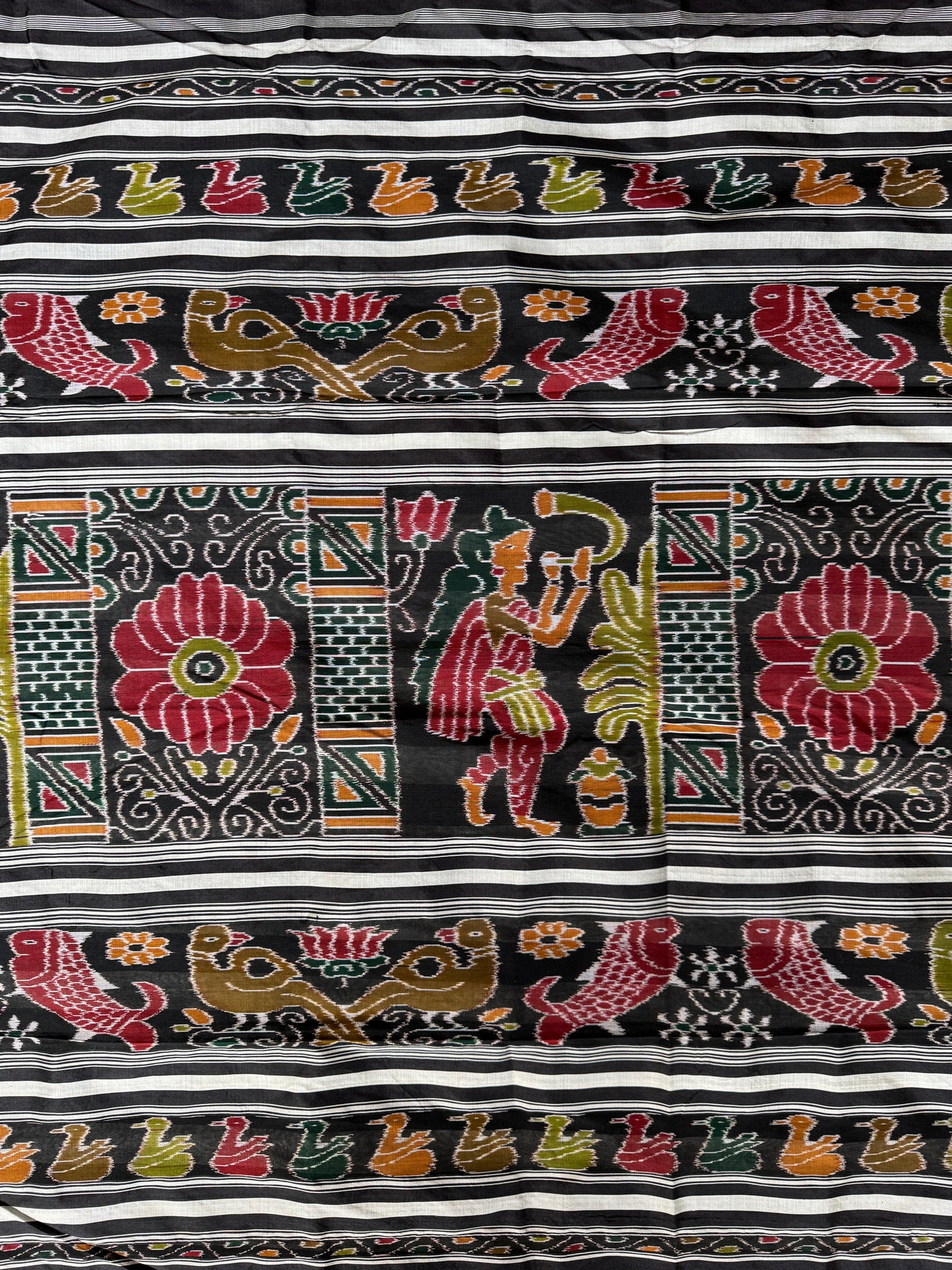 Ikat splendor - black and silver pure silk handloom saree with colorful Ikat pallu and temple border