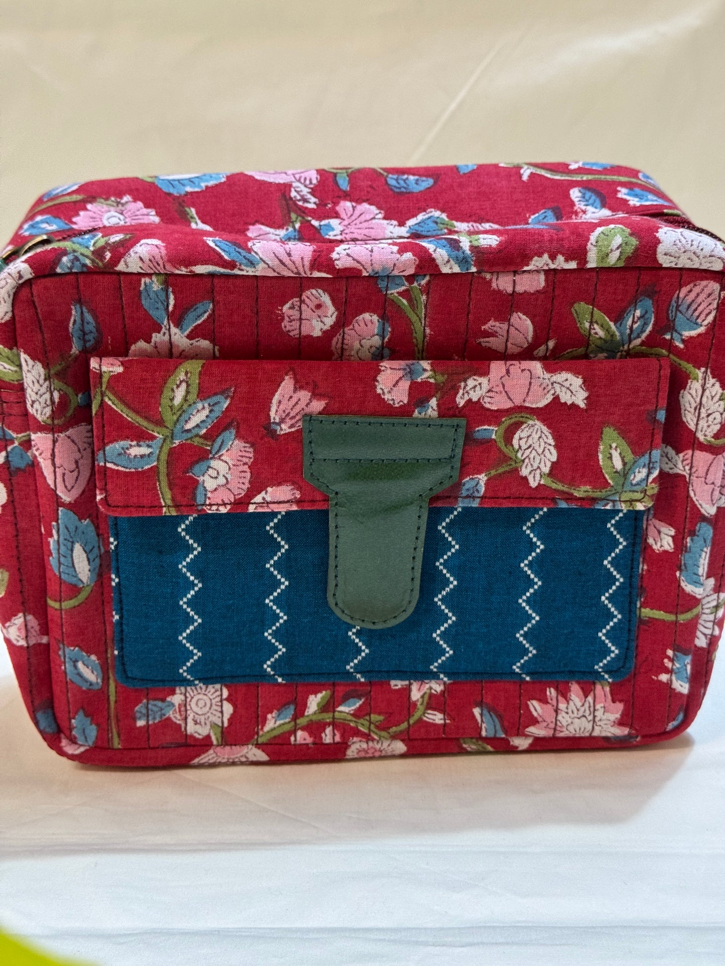 Handcrafted toiletries / travel pouch with leak proof plastic lining plus colorful front pocket with leather patch