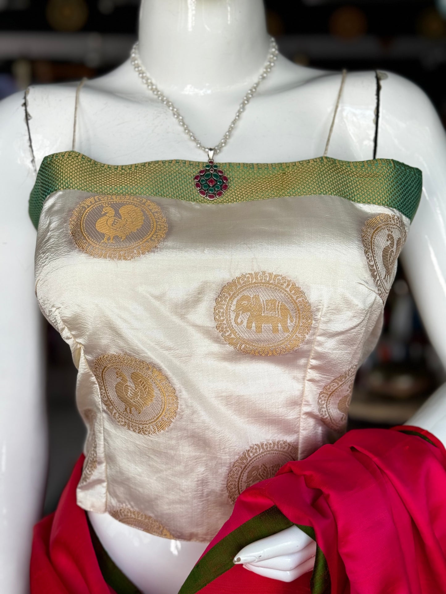 Cream elephant buti noodle strap art silk crop top / blouse with green border