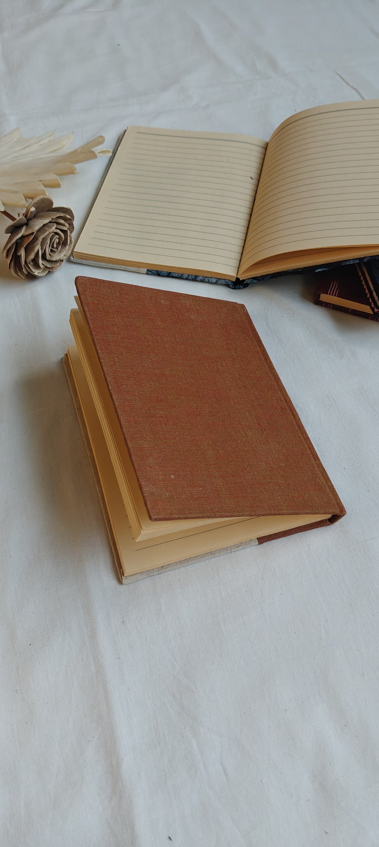 Handmade paper notebooks with hand eco printed fabric cover