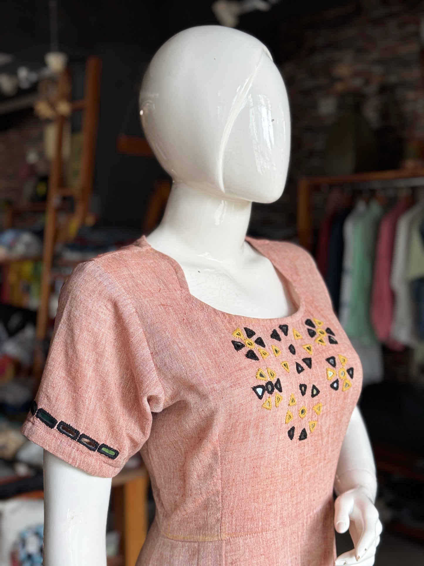 Light peachish maroon kala cotton hand woven pleated dress with mirror embroidery on yoke