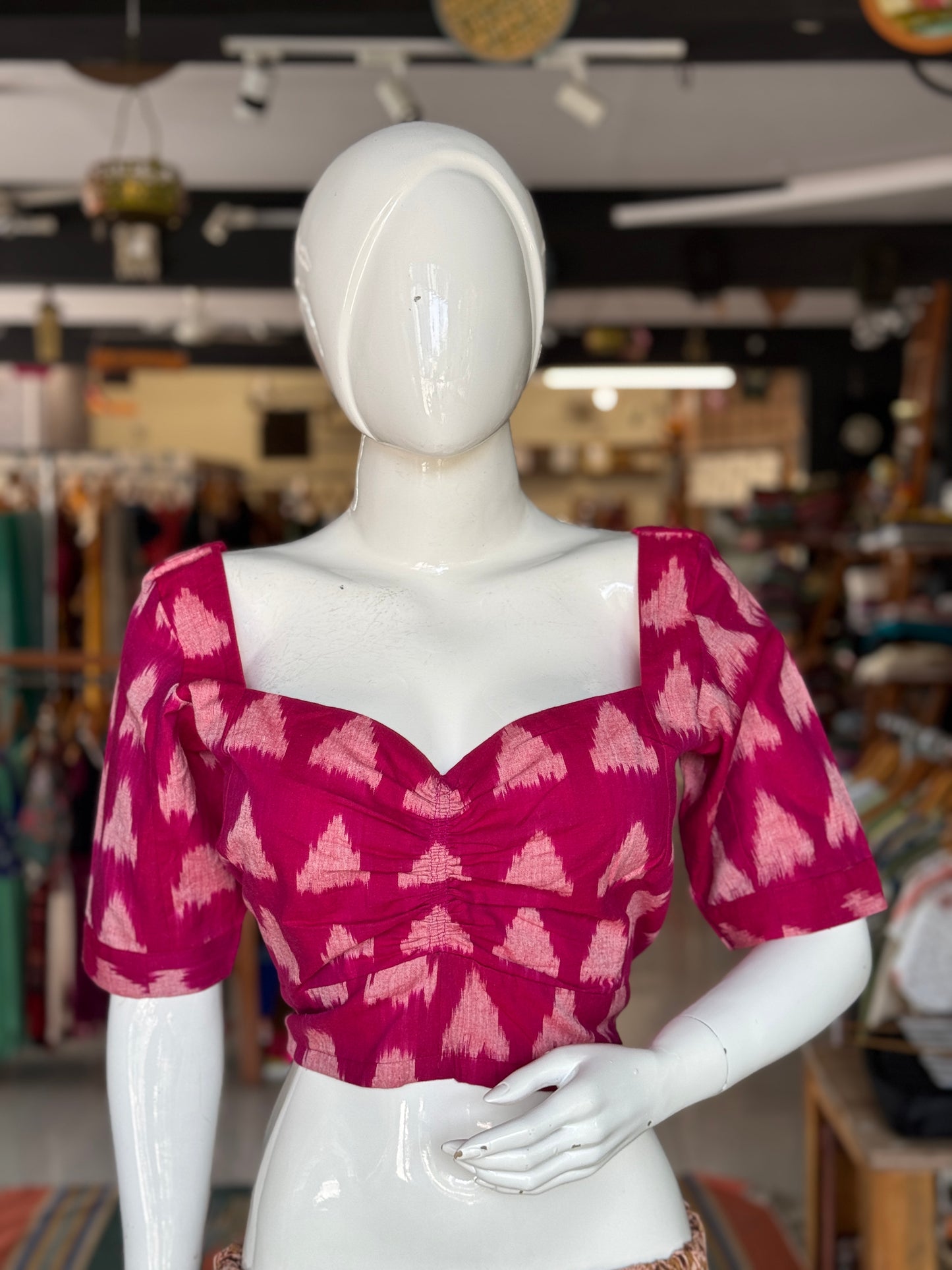 Dark pink triangular design cotton fancy ikat blouse