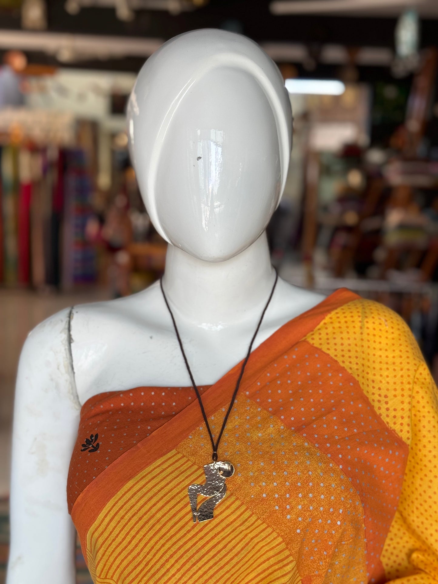 Handcrafted copper pendant with brown thread neck piece