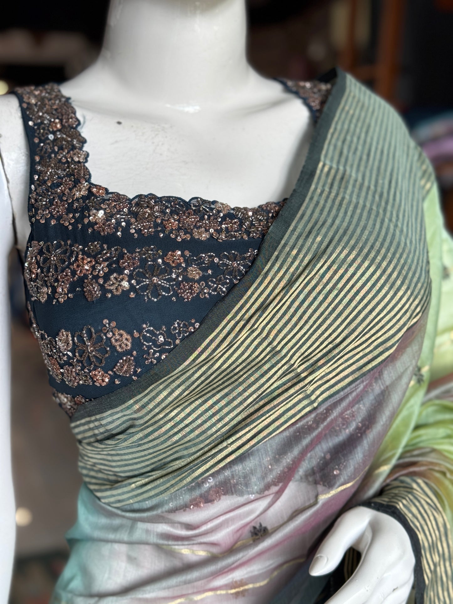 Teal hand embroidered georgette sleeveless blouse with work on front and back