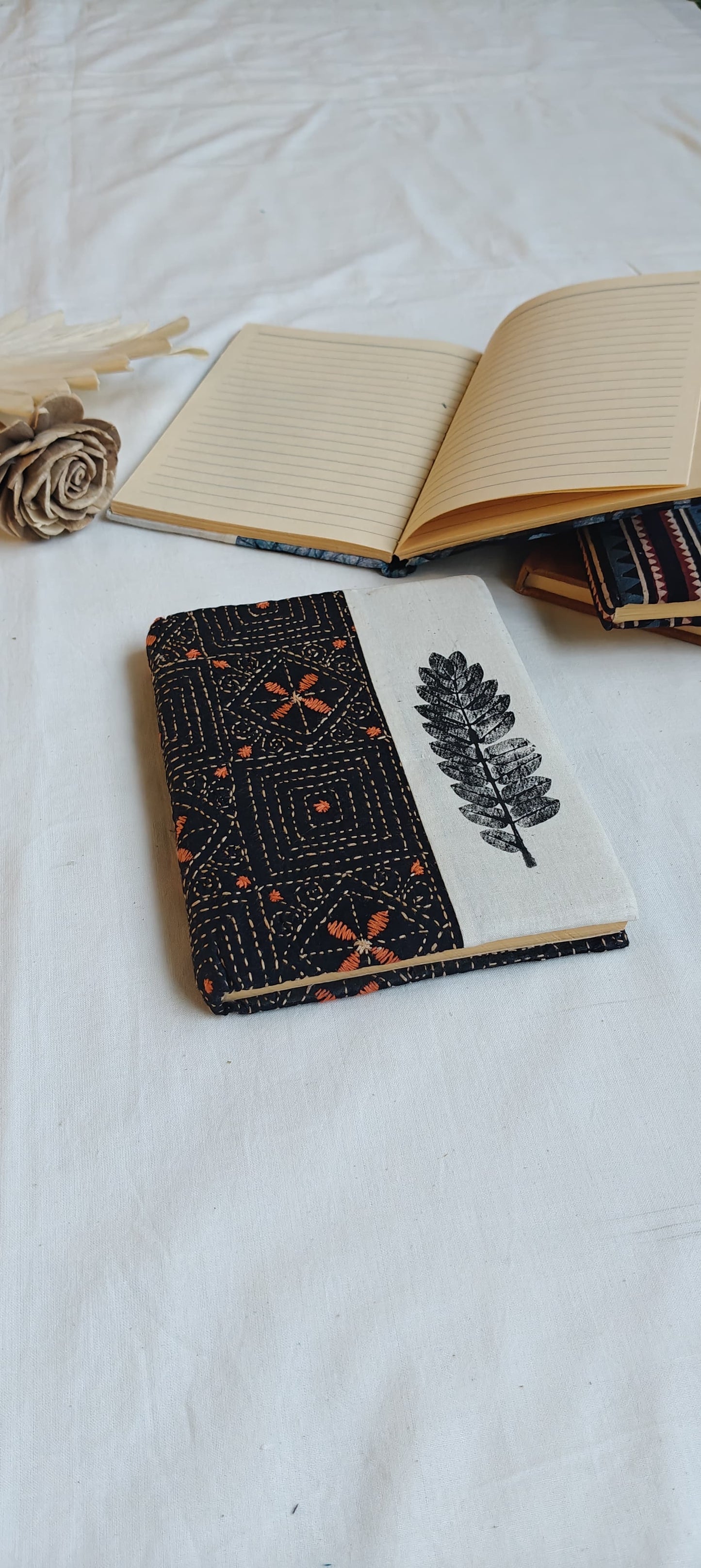Handmade paper notebooks with hand eco printed fabric cover