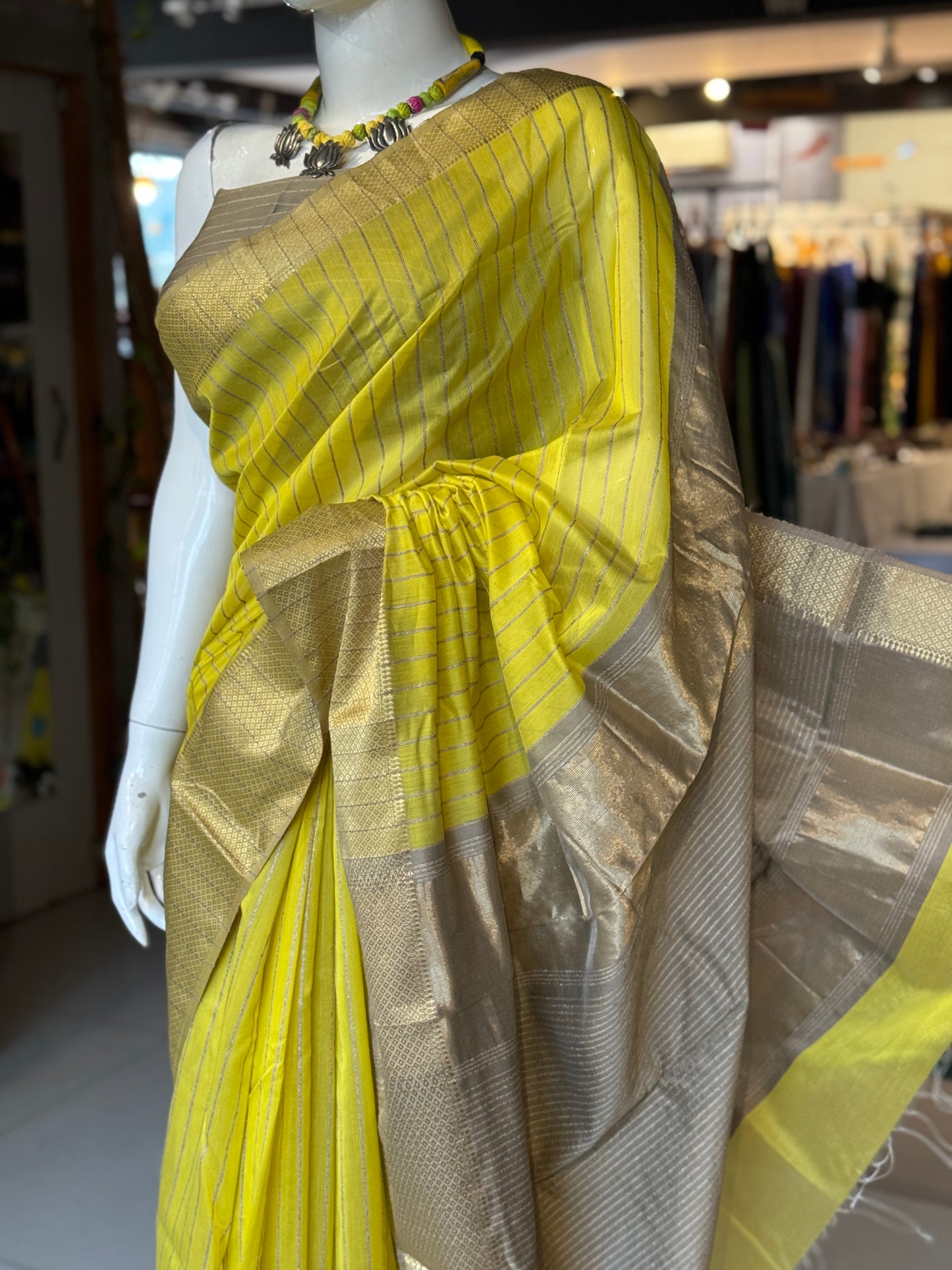 Yellow silk cotton Maheshwari handloom saree with zari pallu and vertical stripes all over