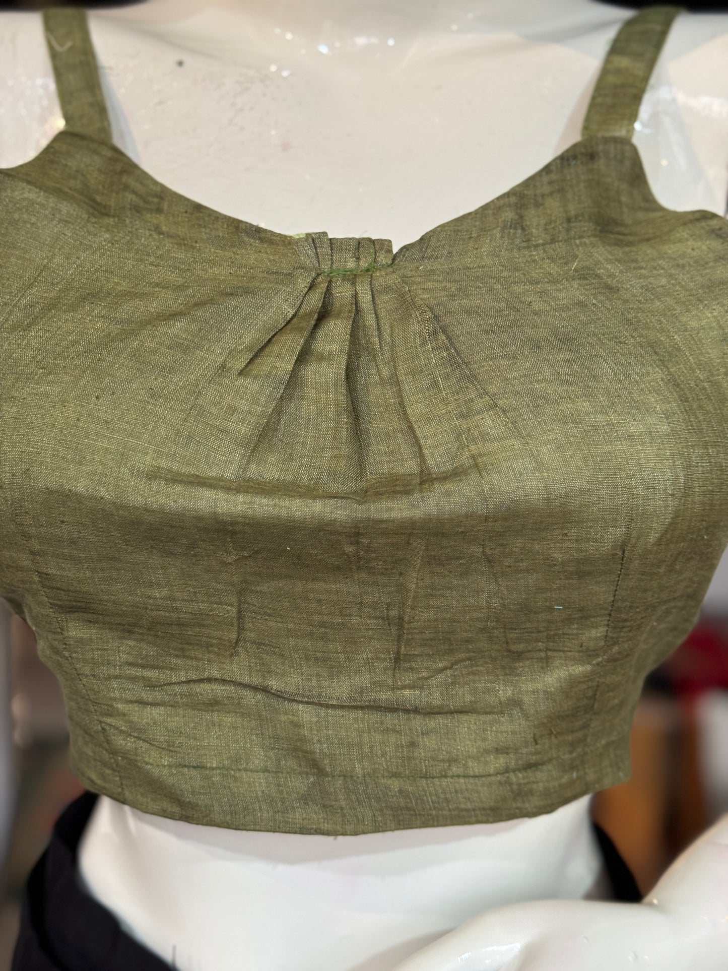 Green silk blouse with strap sleeves and front gathers