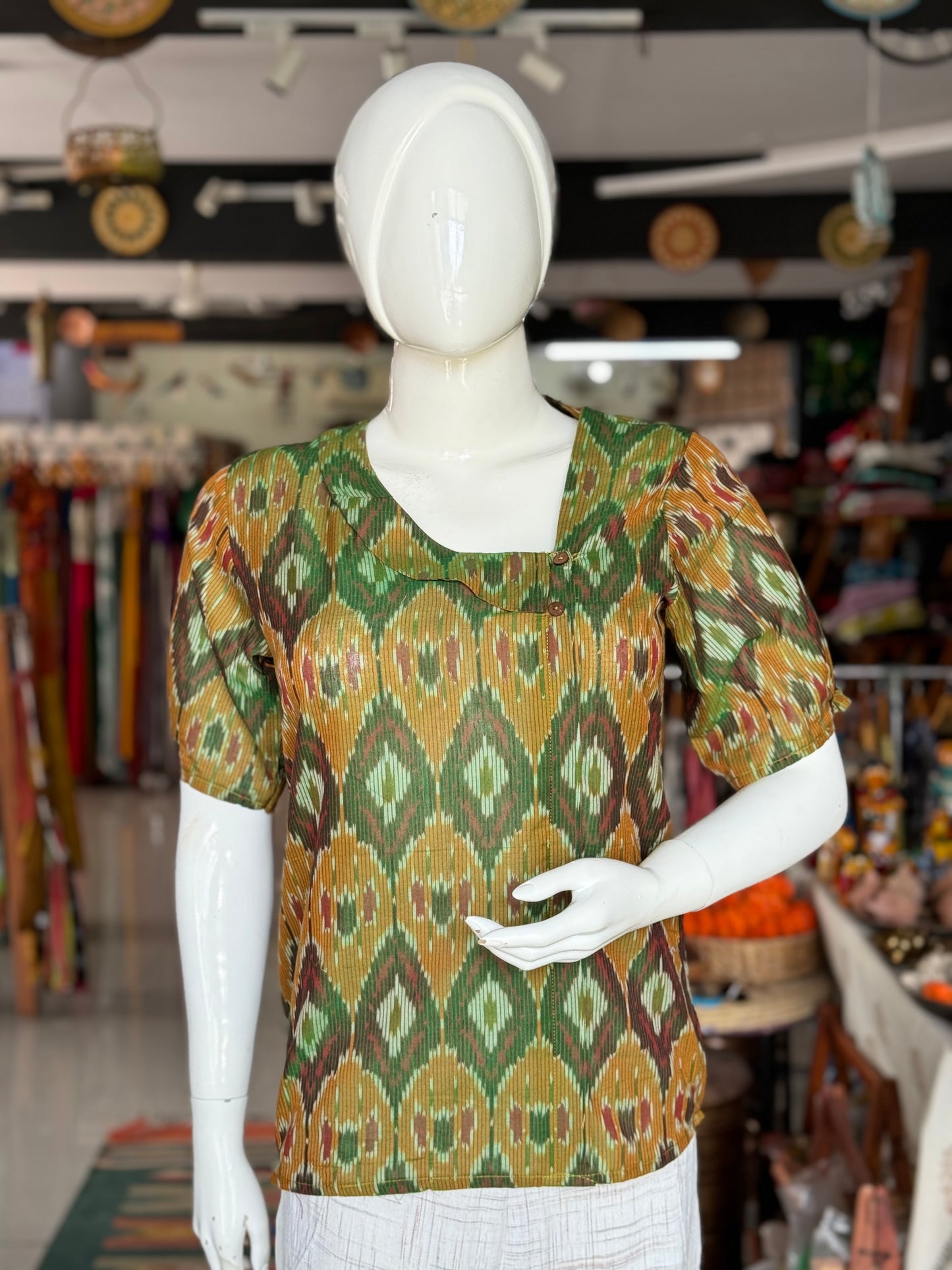 Dark green handloom ikat mercerised cotton top for women with asymmetric neckline