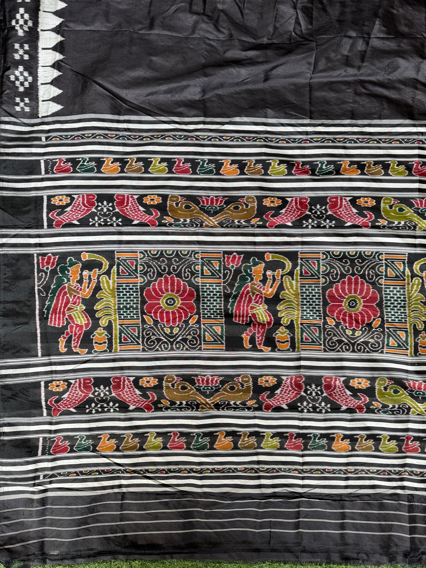 Ikat splendor - black and silver pure silk handloom saree with colorful Ikat pallu and temple border