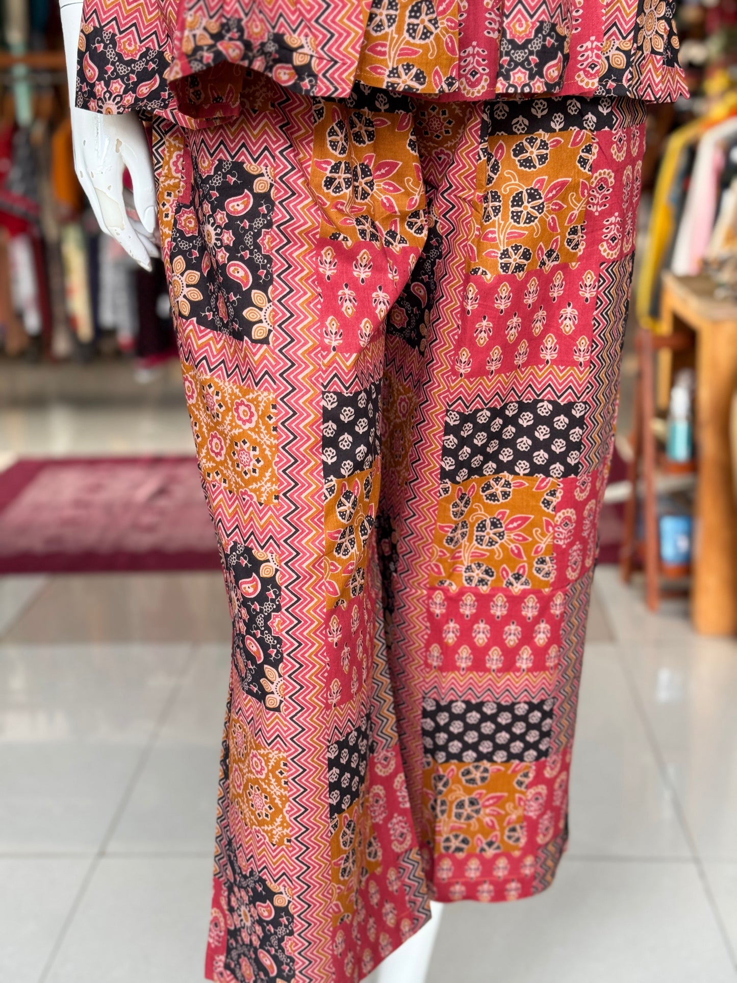 Patch work look hand block printed cotton coord set with noodles strap tie up top and pants