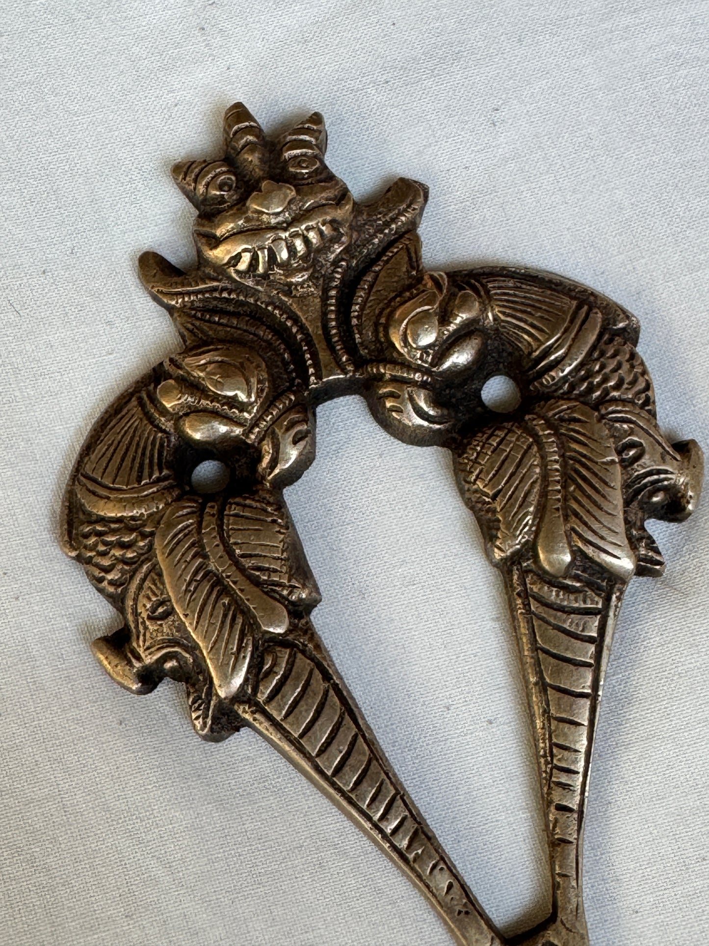 Two peacocks and a face - Brass key / coat hanger