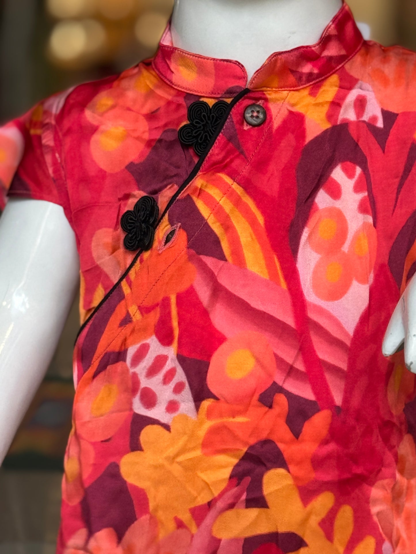 Red n orange floral prints cross button style dress for girls