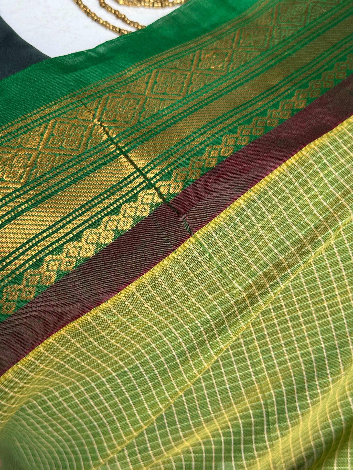 Gadwal cottons - green handwoven Gadwal cotton saree with silk Pallu and borders