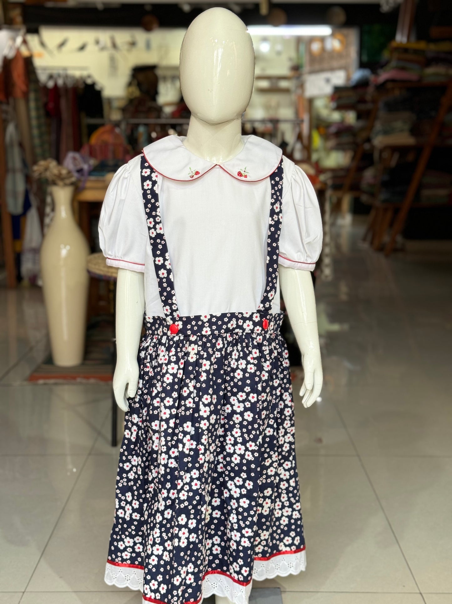 Navy blue floral suspender look cotton embroidered frock with attached white collared top for girls