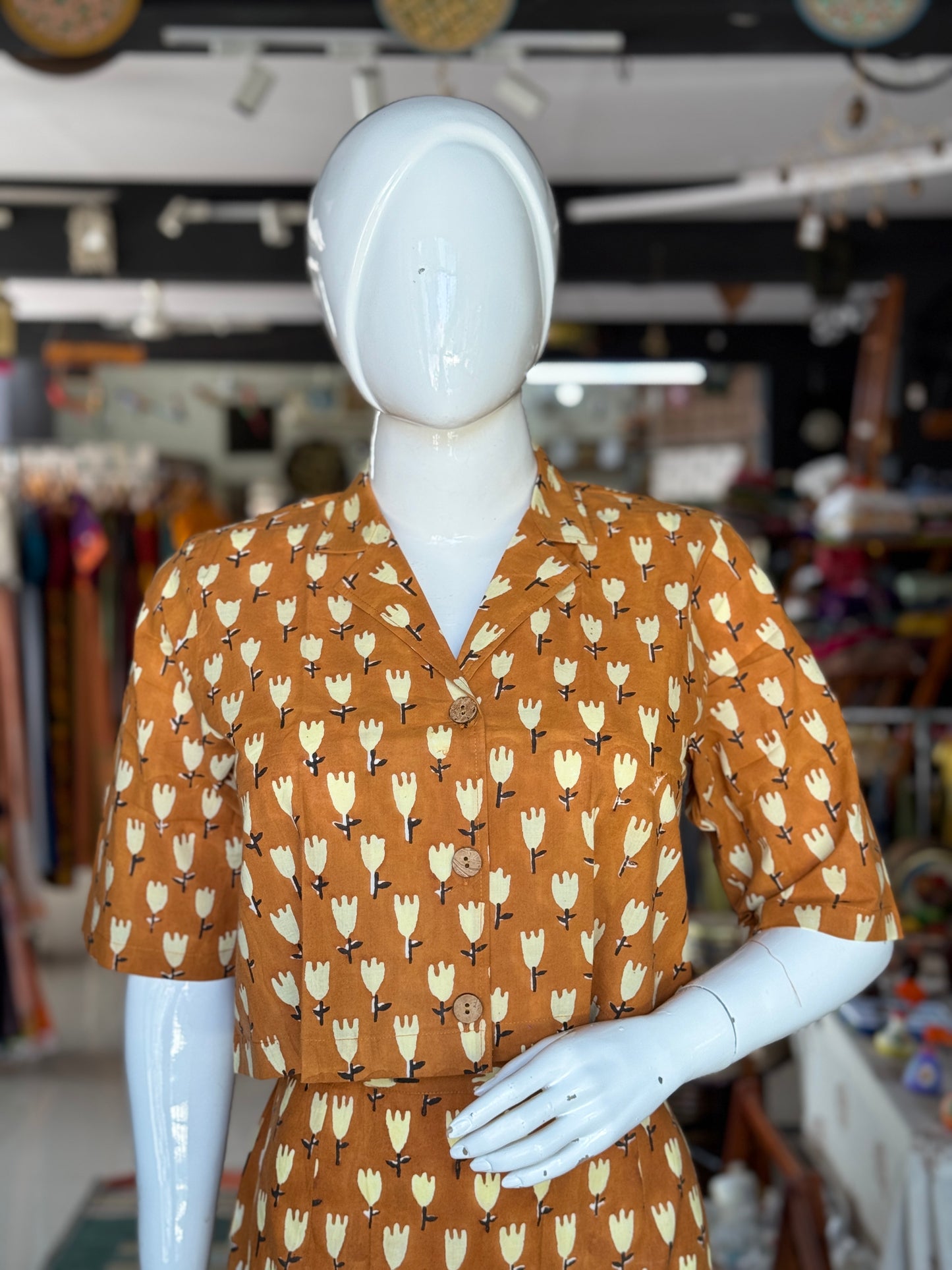Mustard brown hand block printed cotton coord set with collared crop top and straight skirt with front slit
