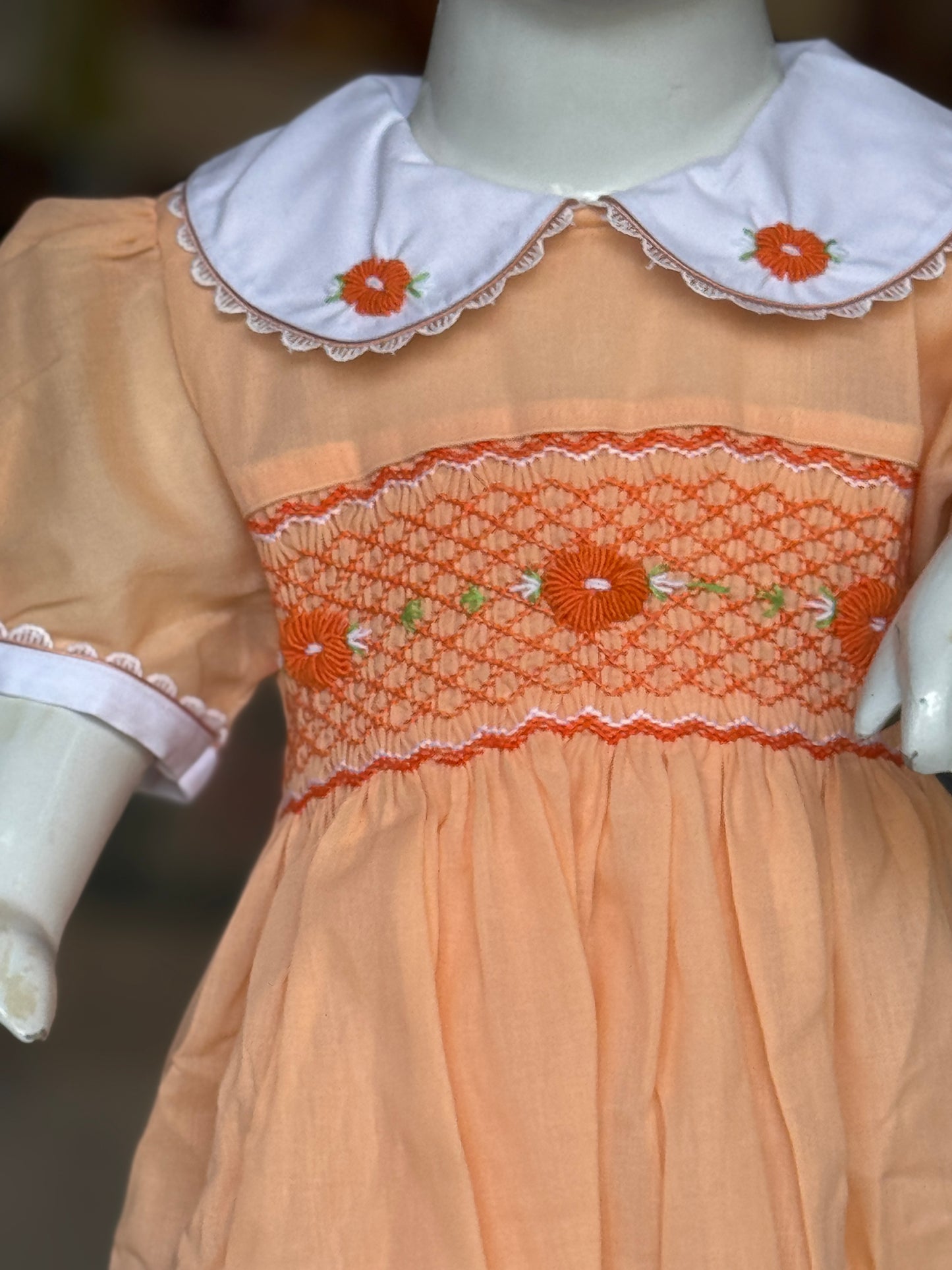 Peach hand embroidered smocking cotton frock for girls with collar