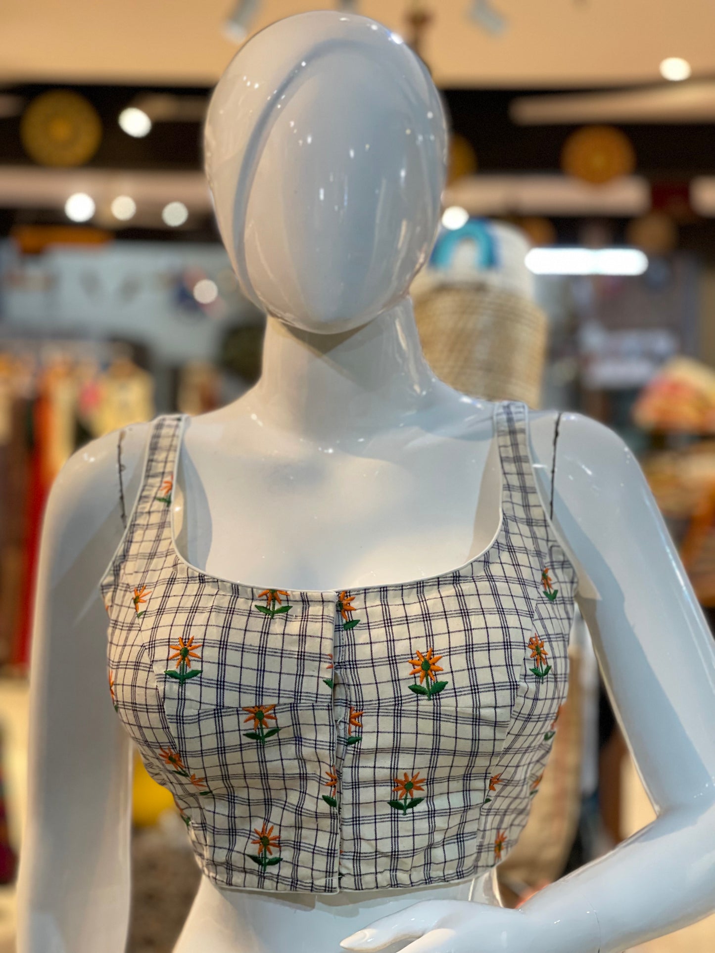 Off white checks sleeveless cotton blouse with floral embroidery