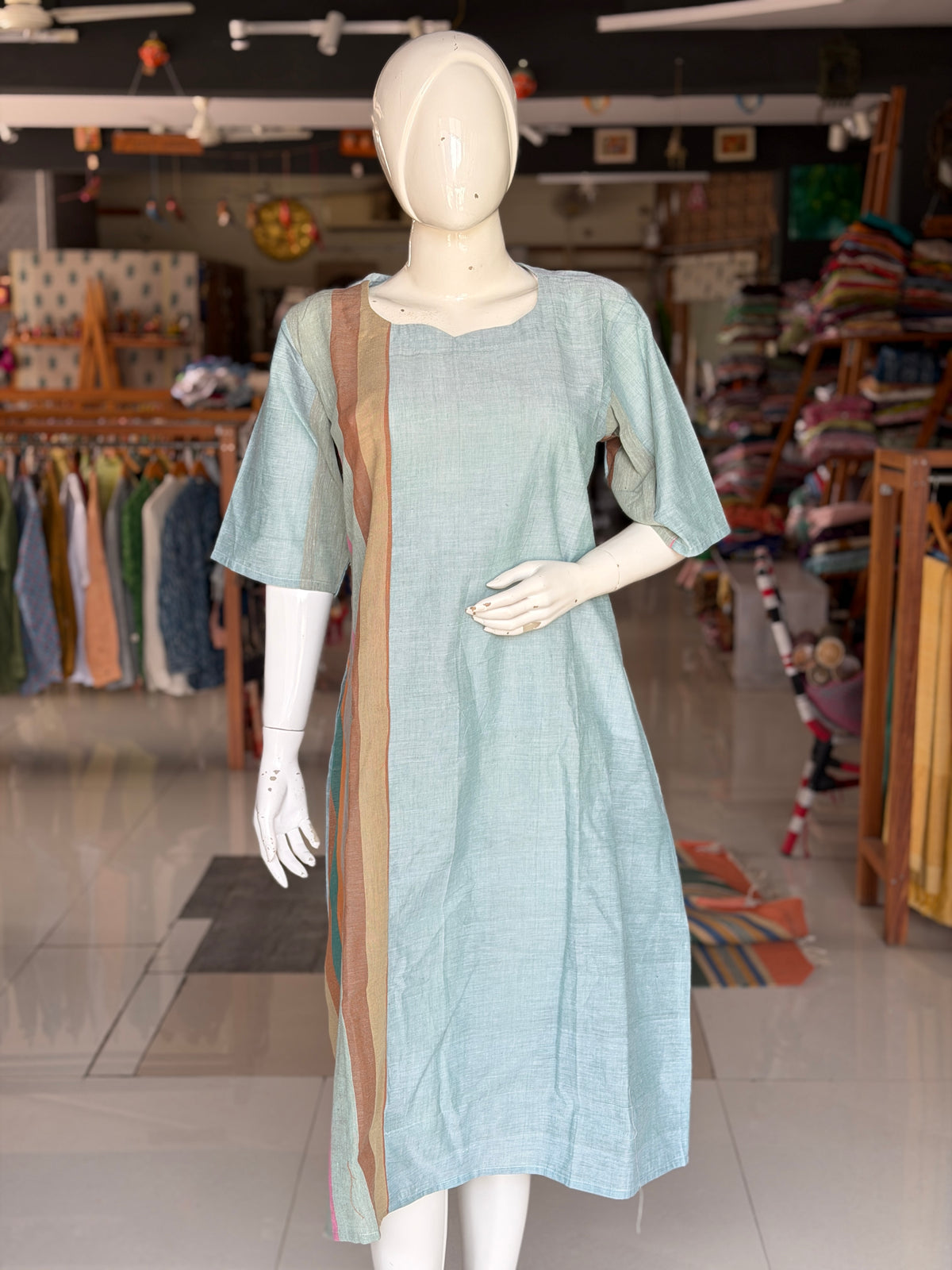 Green handloom cotton dress with hand woven kala cotton stripes on one side