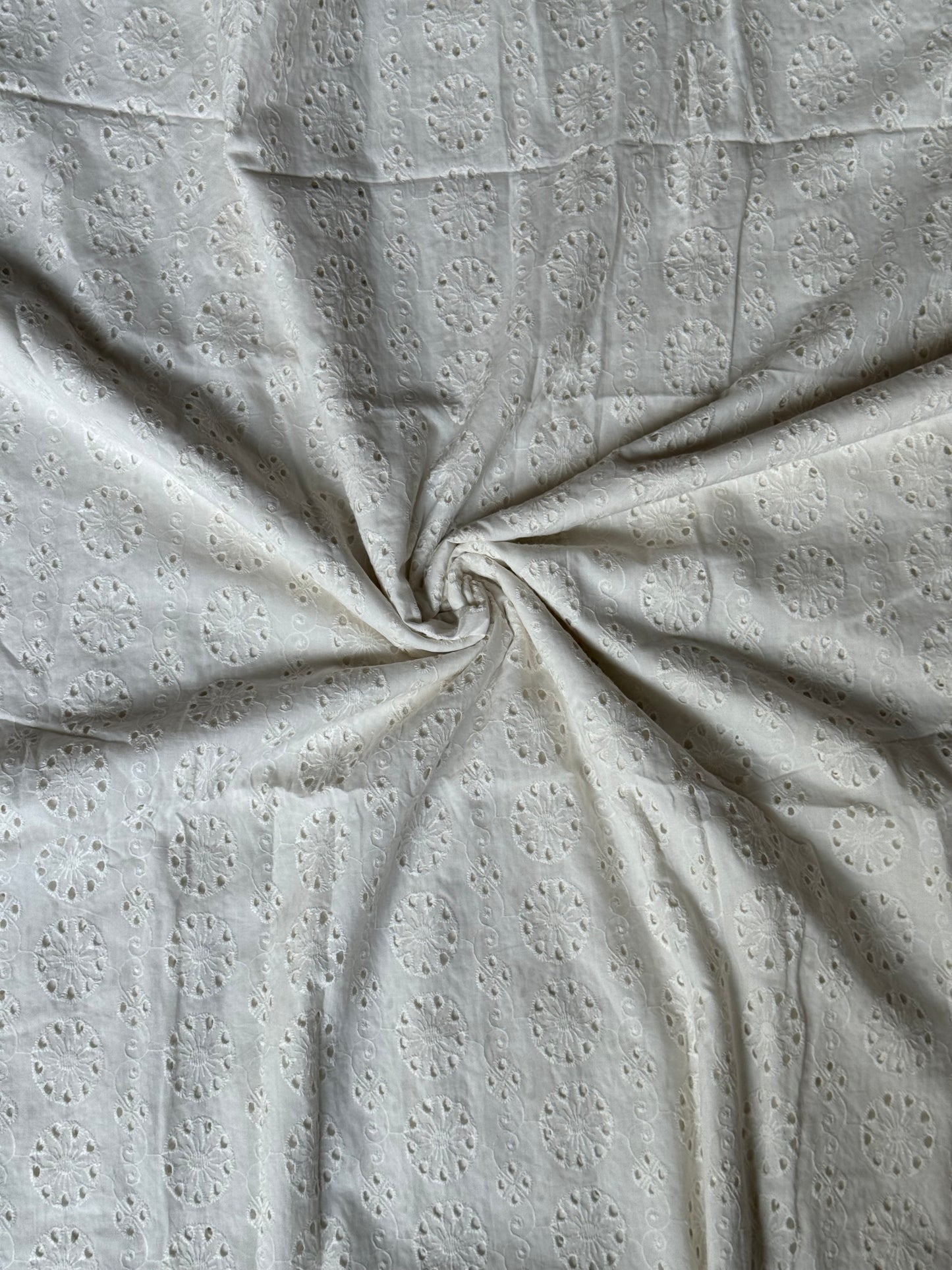 Off white schiffli cut work cotton fabric