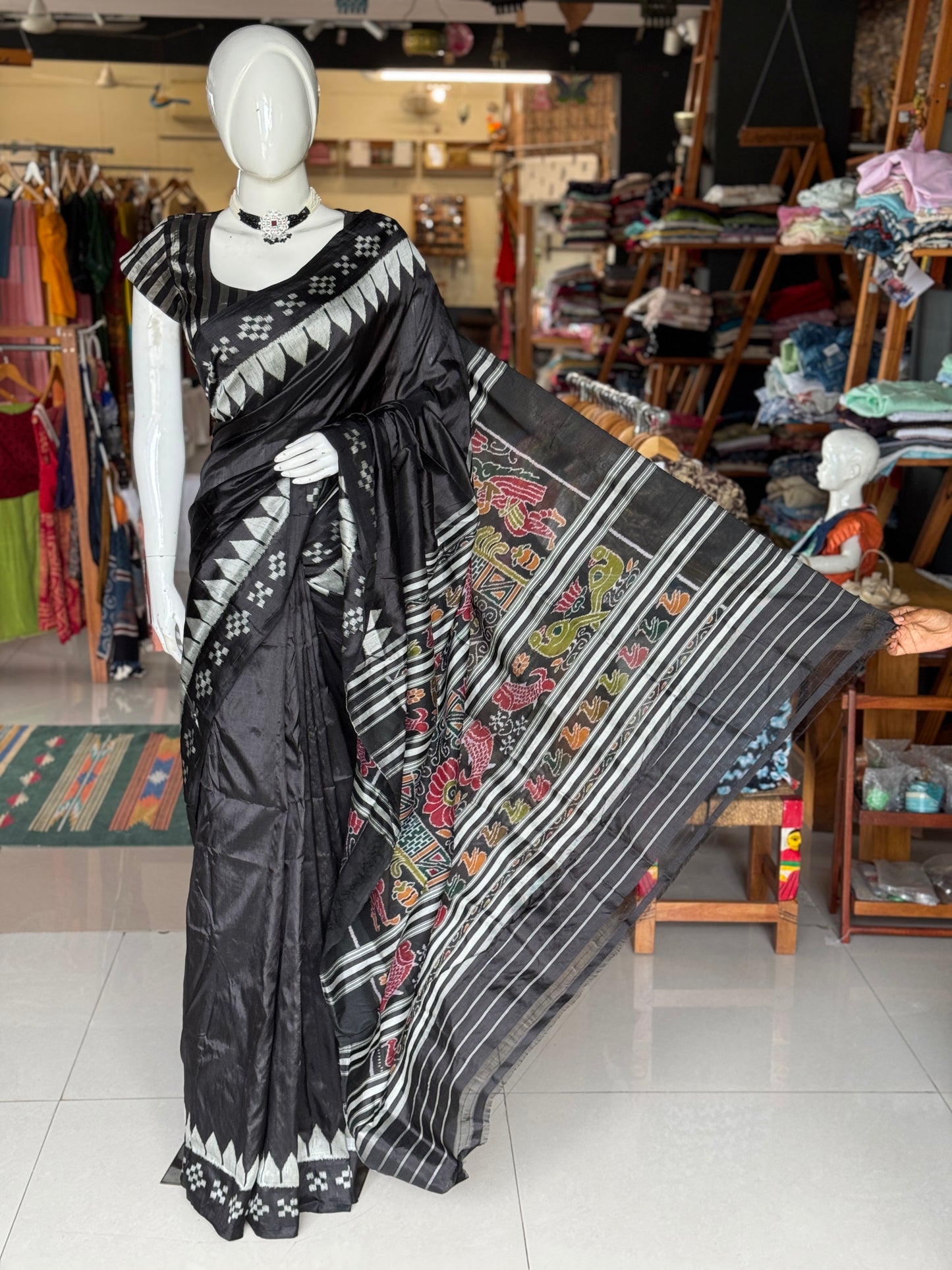 Ikat splendor - black and silver pure silk handloom saree with colorful Ikat pallu and temple border