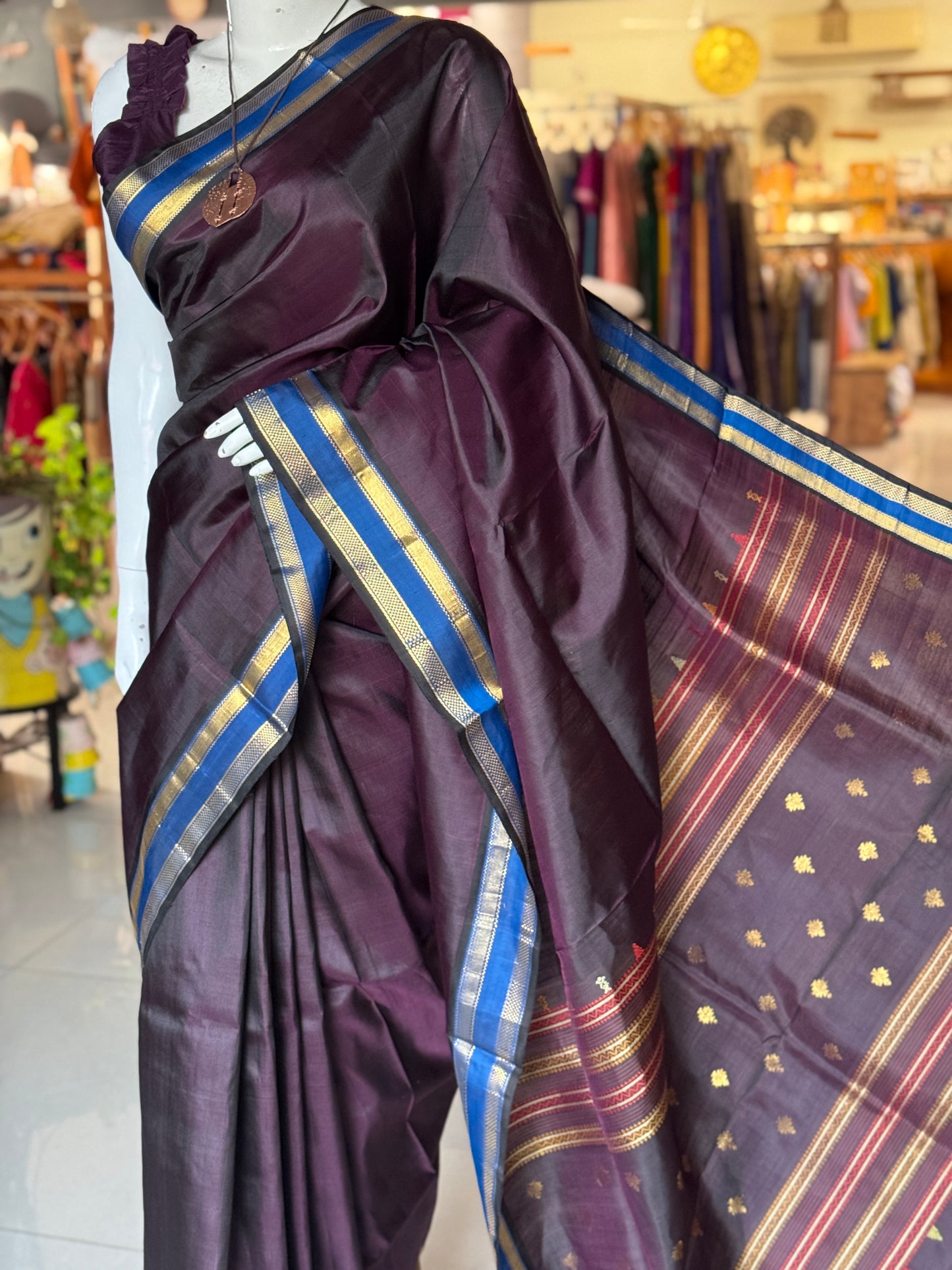 Deep burgundy shade pure silk handloom Kumbakonam pattu saree with blue border and a beautiful palla